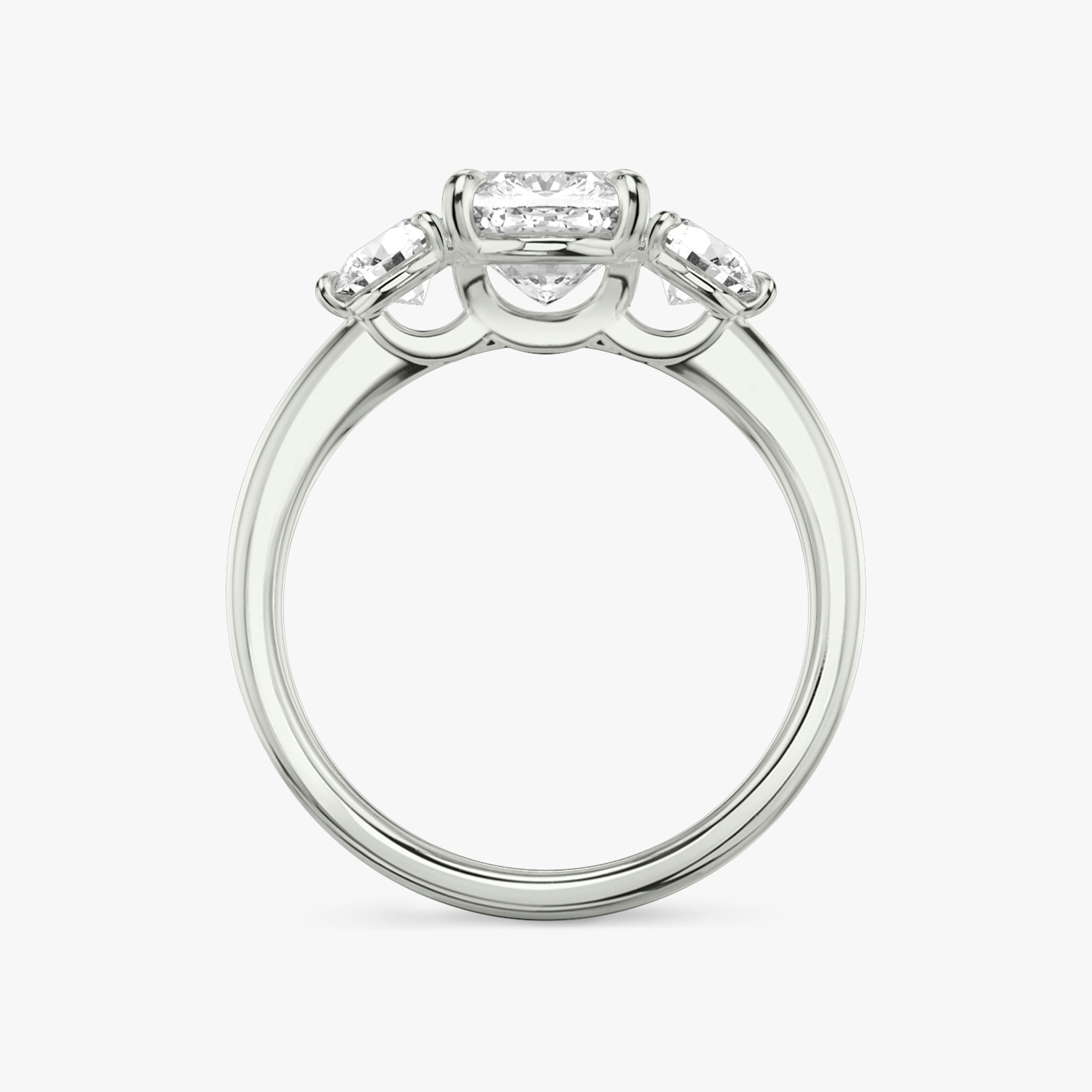 The Three Stone | Cushion | Platinum | bandAccent: Plain | sideStoneCarat: 0.25ct | sideStoneShape: Round Brilliant | diamondOrientation: vertical | caratWeight: other