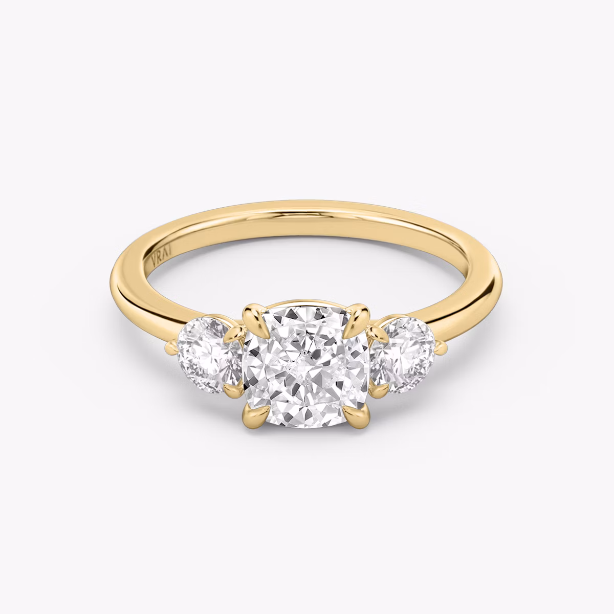 The Three Stone | Cushion | 18k | Yellow Gold | bandAccent: Plain | sideStoneCarat: 0.25ct | sideStoneShape: Round Brilliant | diamondOrientation: vertical | caratWeight: other