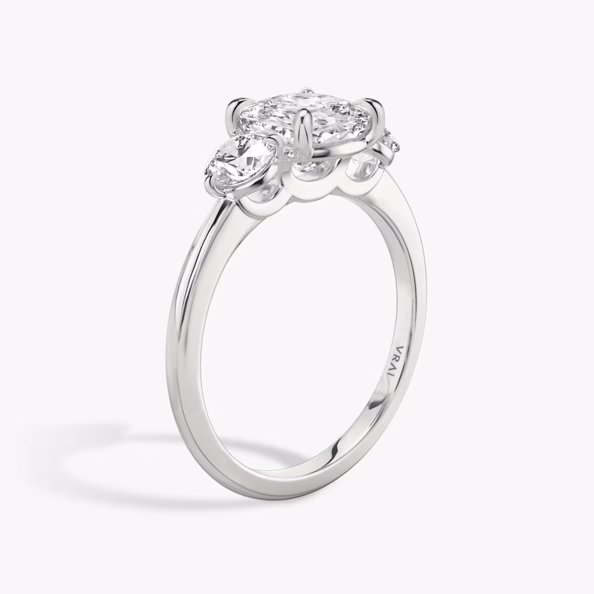 The Three Stone | Cushion | 18k | White Gold | bandAccent: Plain | sideStoneCarat: 0.25ct | sideStoneShape: Round Brilliant | diamondOrientation: vertical | caratWeight: other