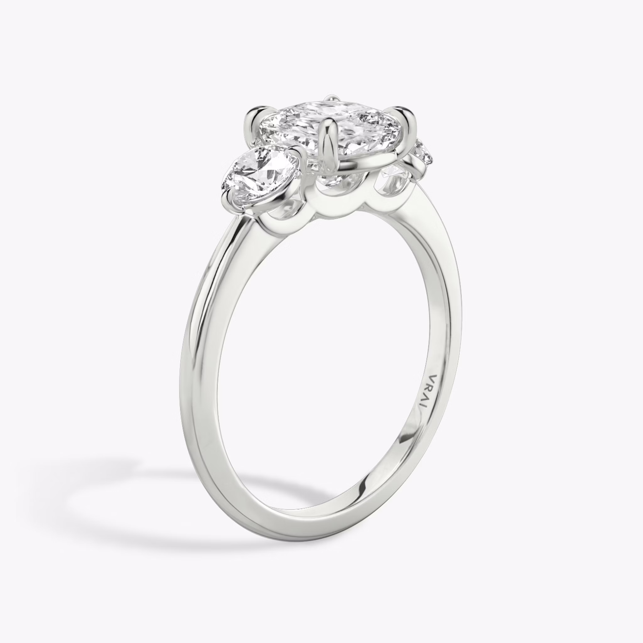 The Three Stone | Cushion | Platinum | bandAccent: Plain | sideStoneCarat: 0.25ct | sideStoneShape: Round Brilliant | diamondOrientation: vertical | caratWeight: other
