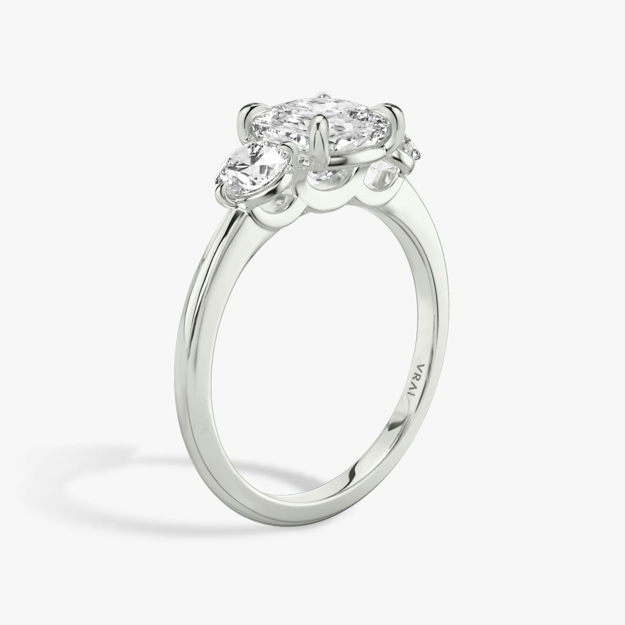 The Three Stone | Cushion | Platinum | bandAccent: Plain | sideStoneCarat: 0.25ct | sideStoneShape: Round Brilliant | diamondOrientation: vertical | caratWeight: other