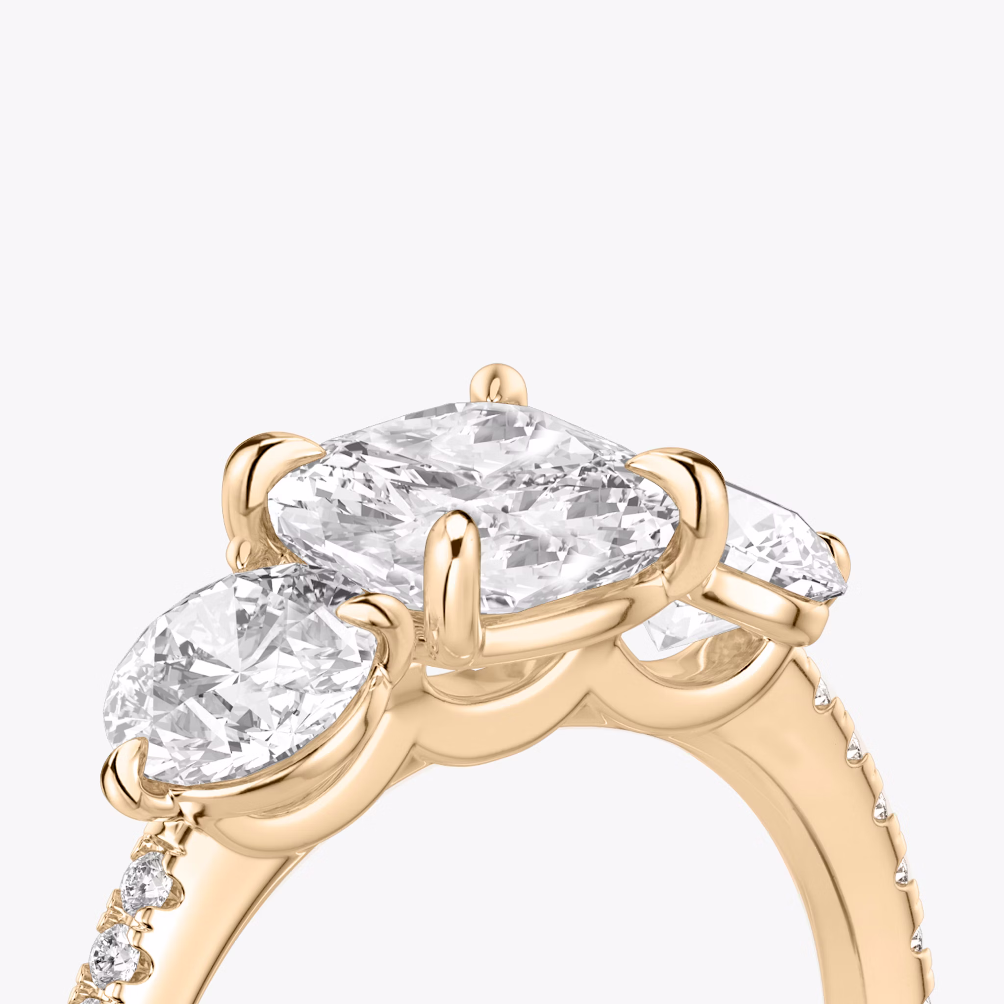 The Three Stone | Cushion | 14k | Rose Gold | bandAccent: Pavé | sideStoneCarat: 0.50ct | sideStoneShape: Round Brilliant | diamondOrientation: vertical | caratWeight: other
