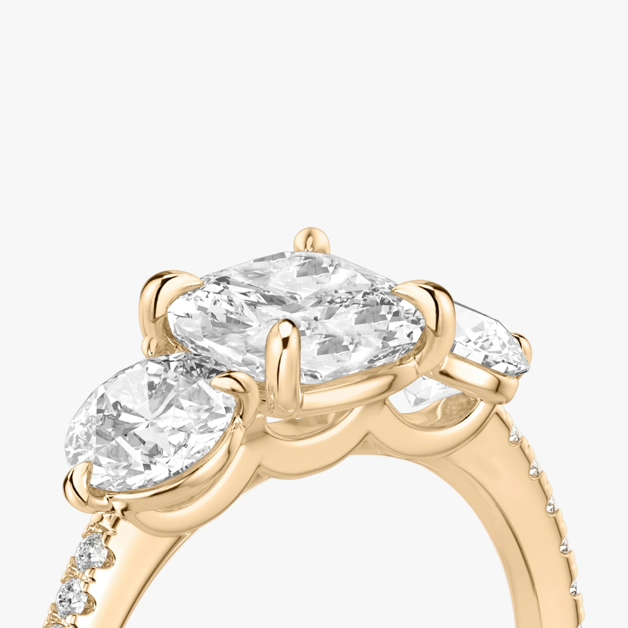 The Three Stone | Cushion | 14k | Rose Gold | bandAccent: Pavé | sideStoneCarat: 0.50ct | sideStoneShape: Round Brilliant | diamondOrientation: vertical | caratWeight: other