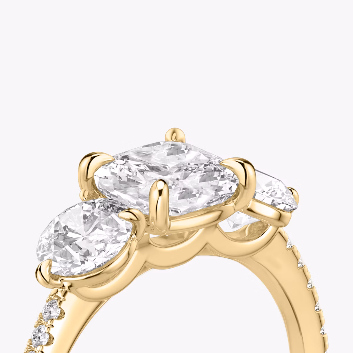 The Three Stone | Cushion | 18k | Yellow Gold | bandAccent: Pavé | sideStoneCarat: 0.50ct | sideStoneShape: Round Brilliant | diamondOrientation: vertical | caratWeight: other