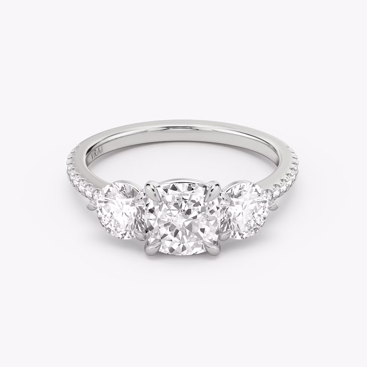 Three Stone Cushion and Round Brilliant RIng