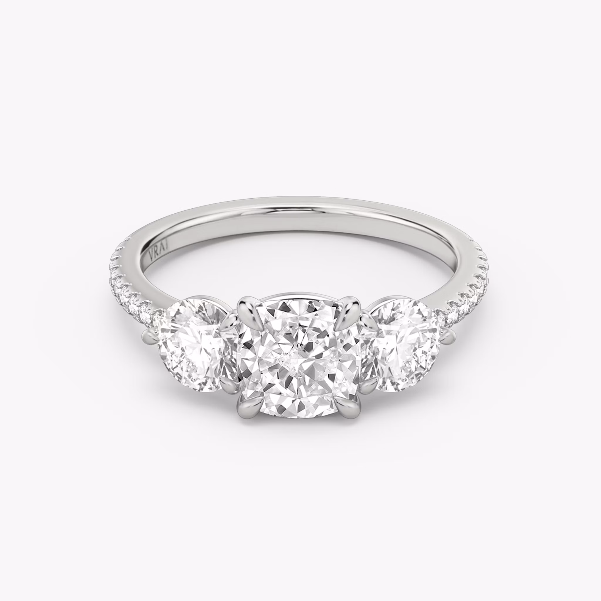 Three Stone Cushion and Round Brilliant RIng