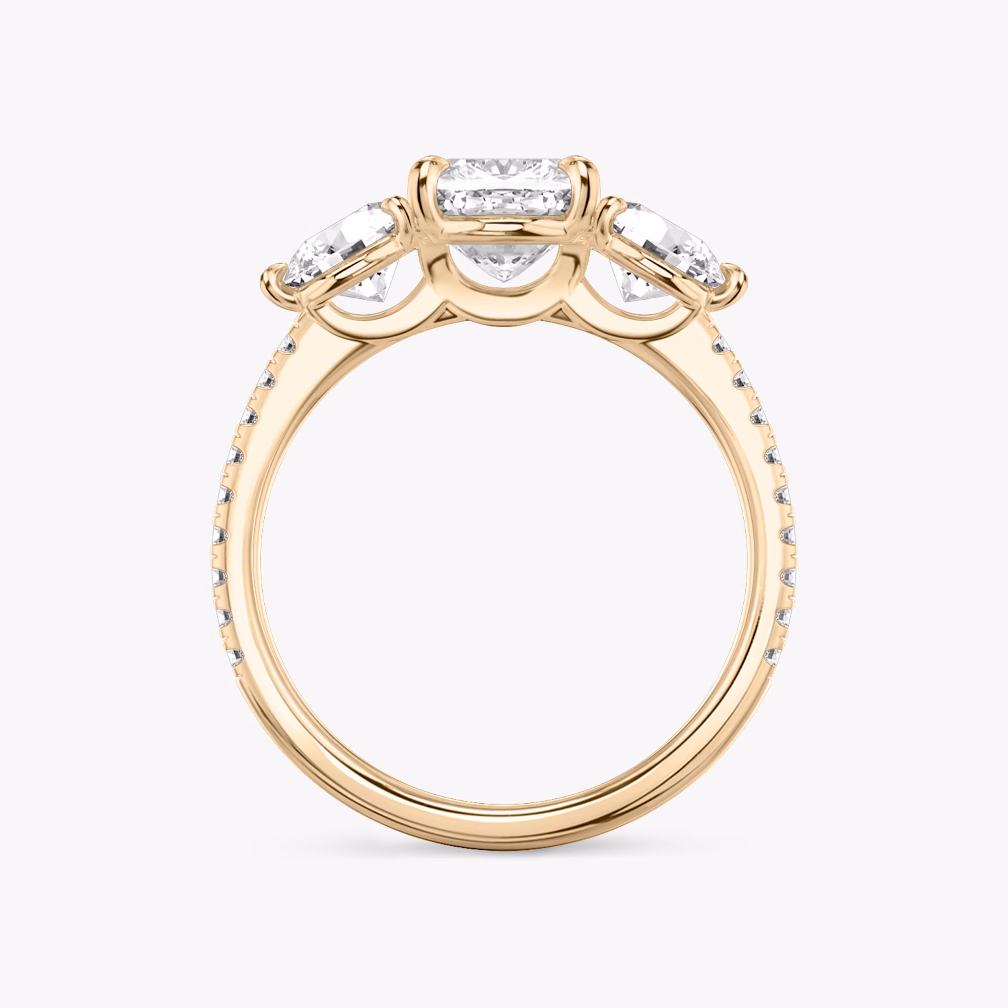 The Three Stone | Cushion | 14k | Rose Gold | bandAccent: Pavé | sideStoneCarat: 0.50ct | sideStoneShape: Round Brilliant | diamondOrientation: vertical | caratWeight: other
