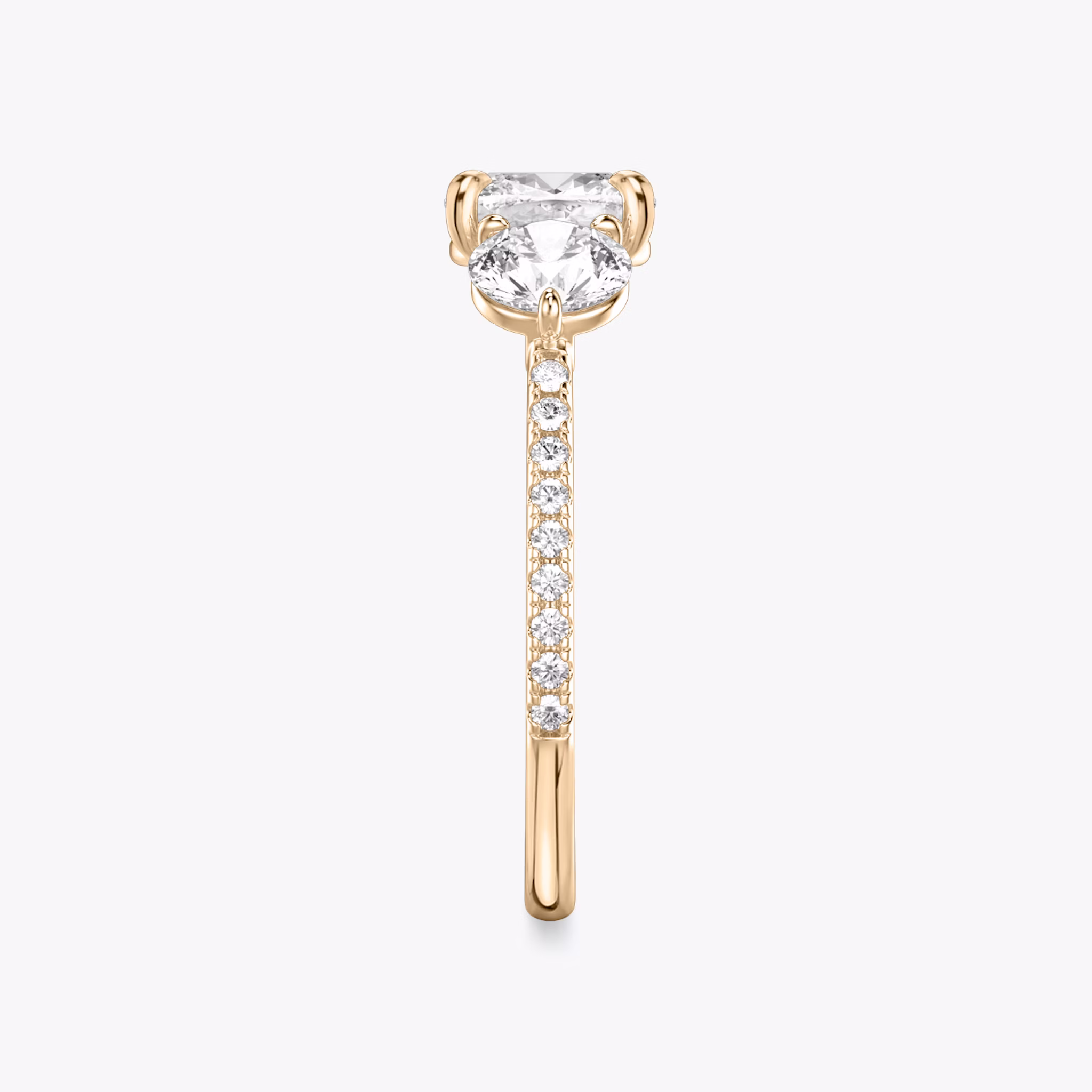 The Three Stone | Cushion | 14k | Rose Gold | bandAccent: Pavé | sideStoneCarat: 0.50ct | sideStoneShape: Round Brilliant | diamondOrientation: vertical | caratWeight: other