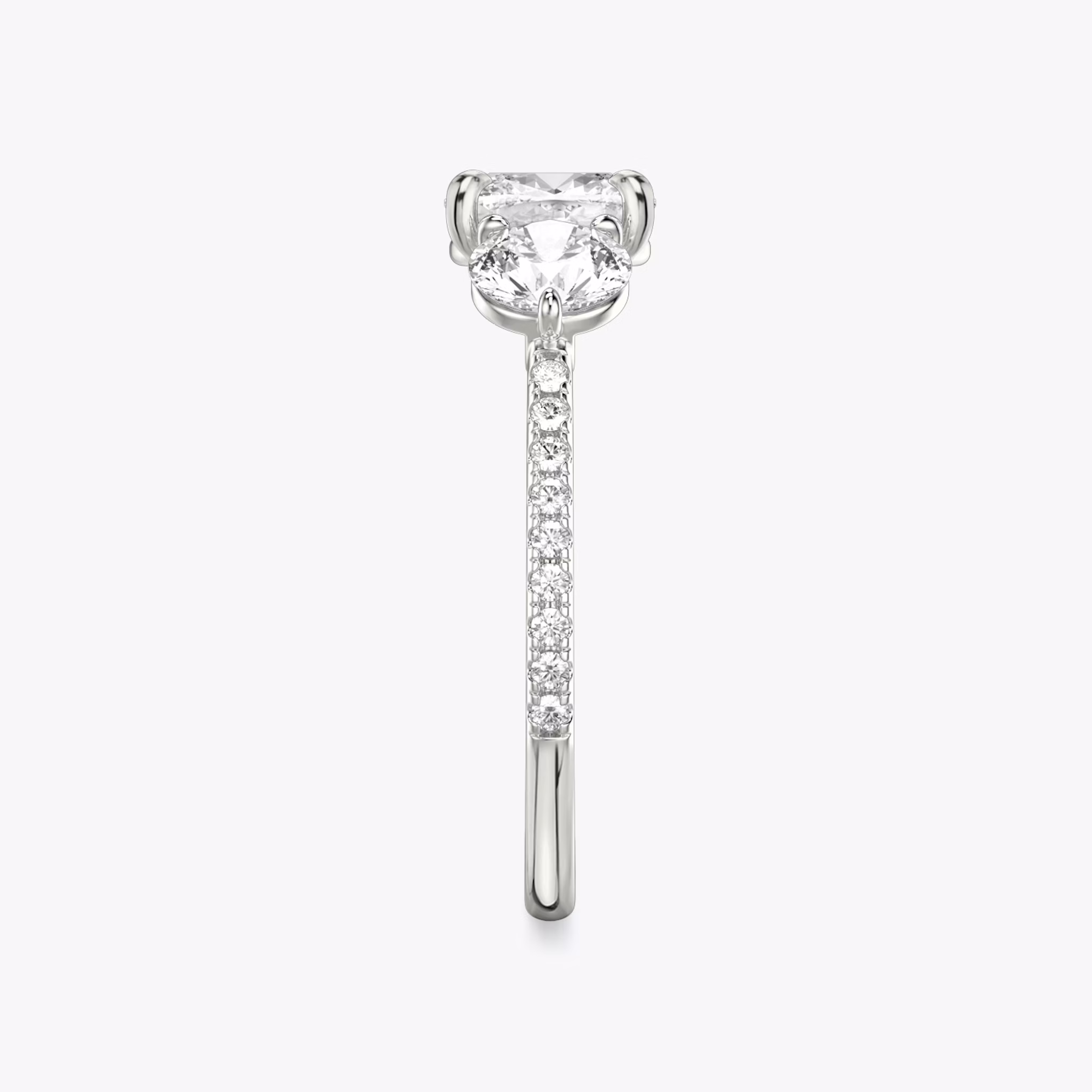 The Three Stone | Cushion | 18k | White Gold | bandAccent: Pavé | sideStoneCarat: 0.50ct | sideStoneShape: Round Brilliant | diamondOrientation: vertical | caratWeight: other