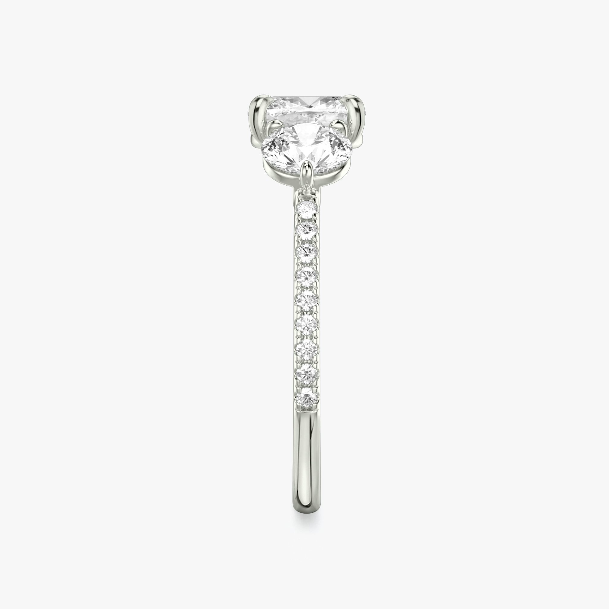 The Three Stone | Cushion | 18k | White Gold | bandAccent: Pavé | sideStoneCarat: 0.50ct | sideStoneShape: Round Brilliant | diamondOrientation: vertical | caratWeight: other