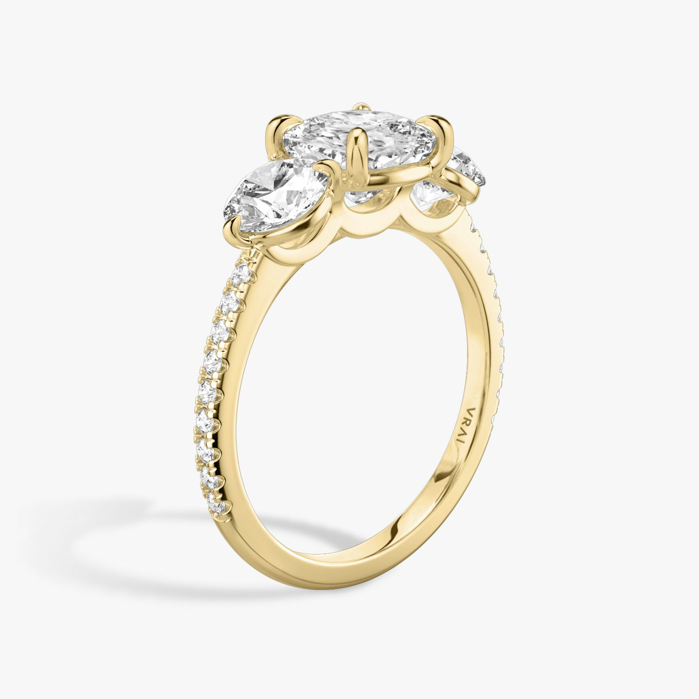 The Three Stone | Cushion | 18k | Yellow Gold | bandAccent: Pavé | sideStoneCarat: 0.50ct | sideStoneShape: Round Brilliant | diamondOrientation: vertical | caratWeight: other