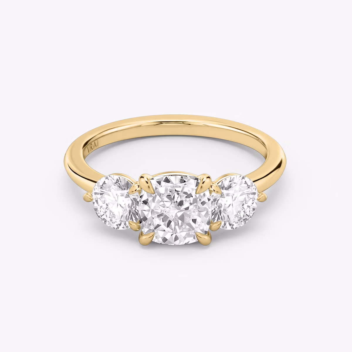 Three Stone Cushion and Round Brilliant RIng