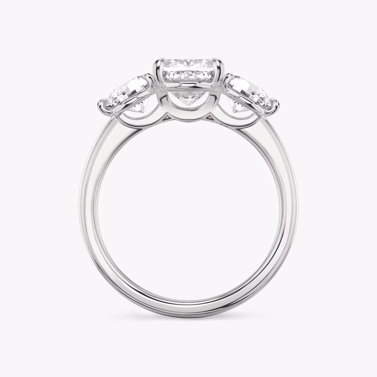 The Three Stone | Cushion | 18k | White Gold | bandAccent: Plain | sideStoneCarat: 0.50ct | sideStoneShape: Round Brilliant | diamondOrientation: vertical | caratWeight: other