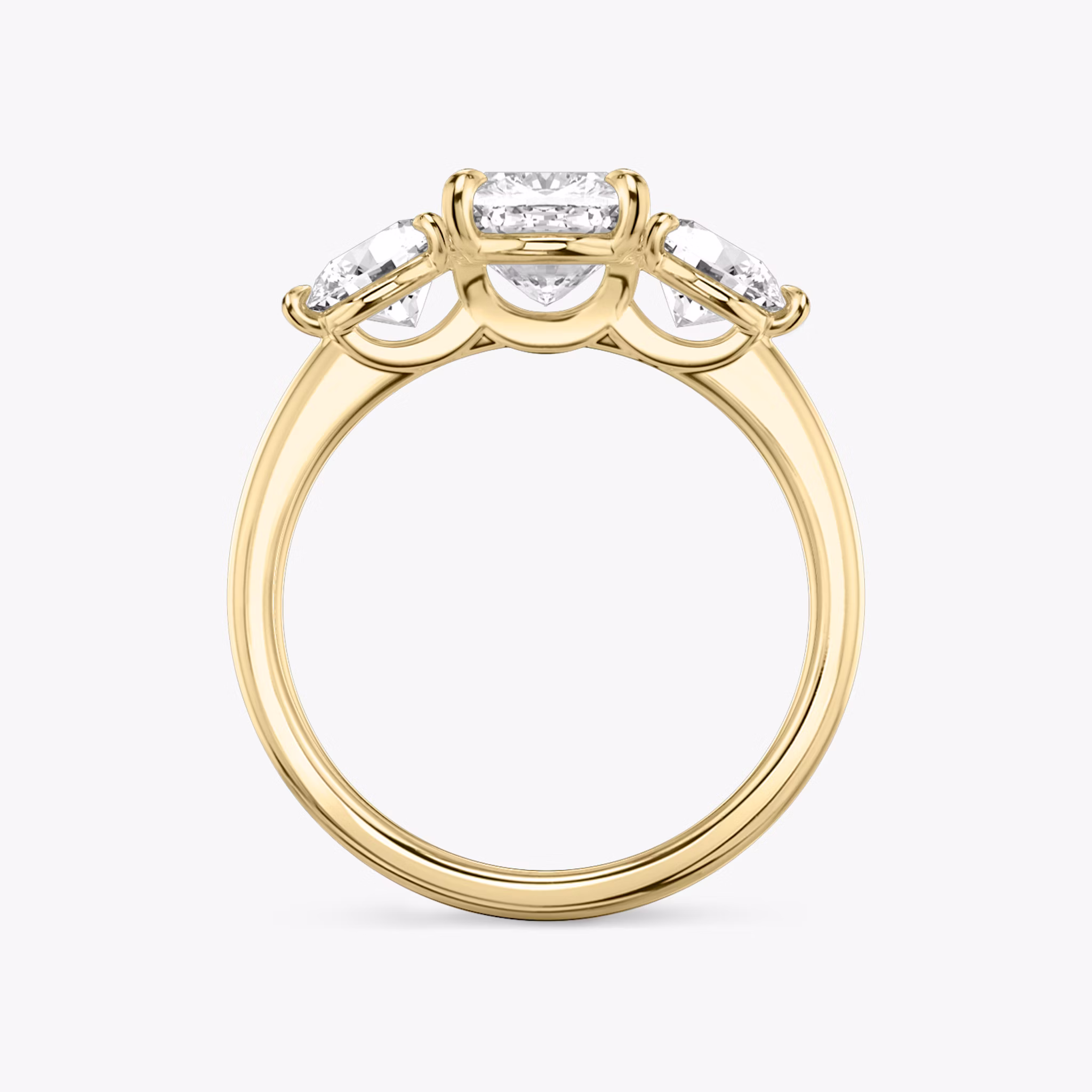 The Three Stone | Cushion | 18k | Yellow Gold | bandAccent: Plain | sideStoneCarat: 0.50ct | sideStoneShape: Round Brilliant | diamondOrientation: vertical | caratWeight: other