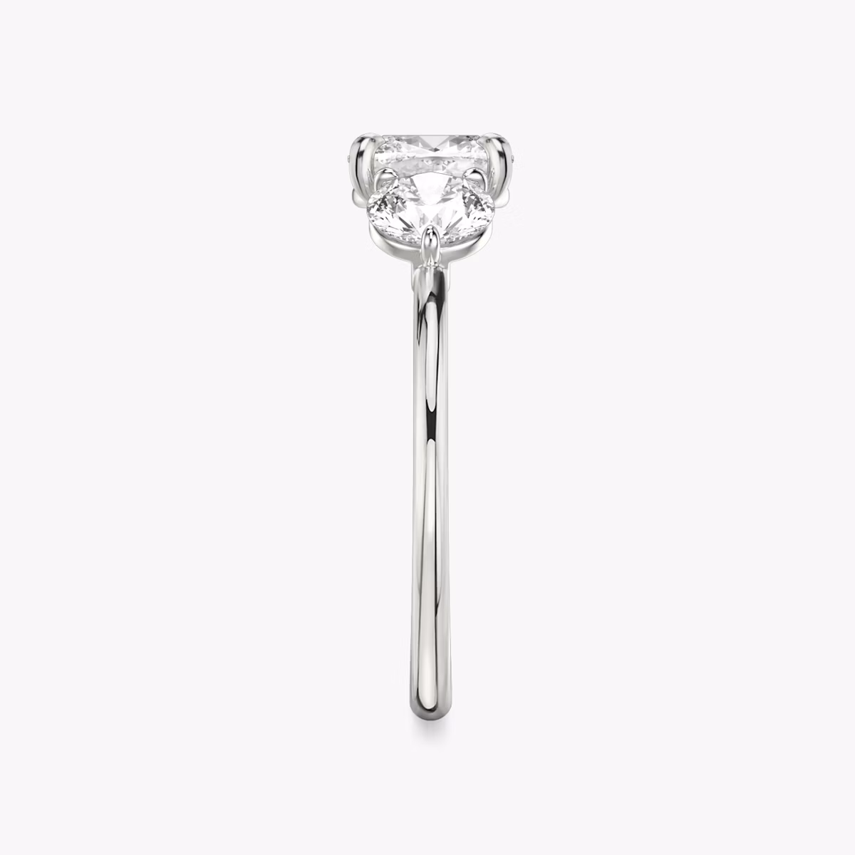 The Three Stone | Cushion | 18k | White Gold | bandAccent: Plain | sideStoneCarat: 0.50ct | sideStoneShape: Round Brilliant | diamondOrientation: vertical | caratWeight: other