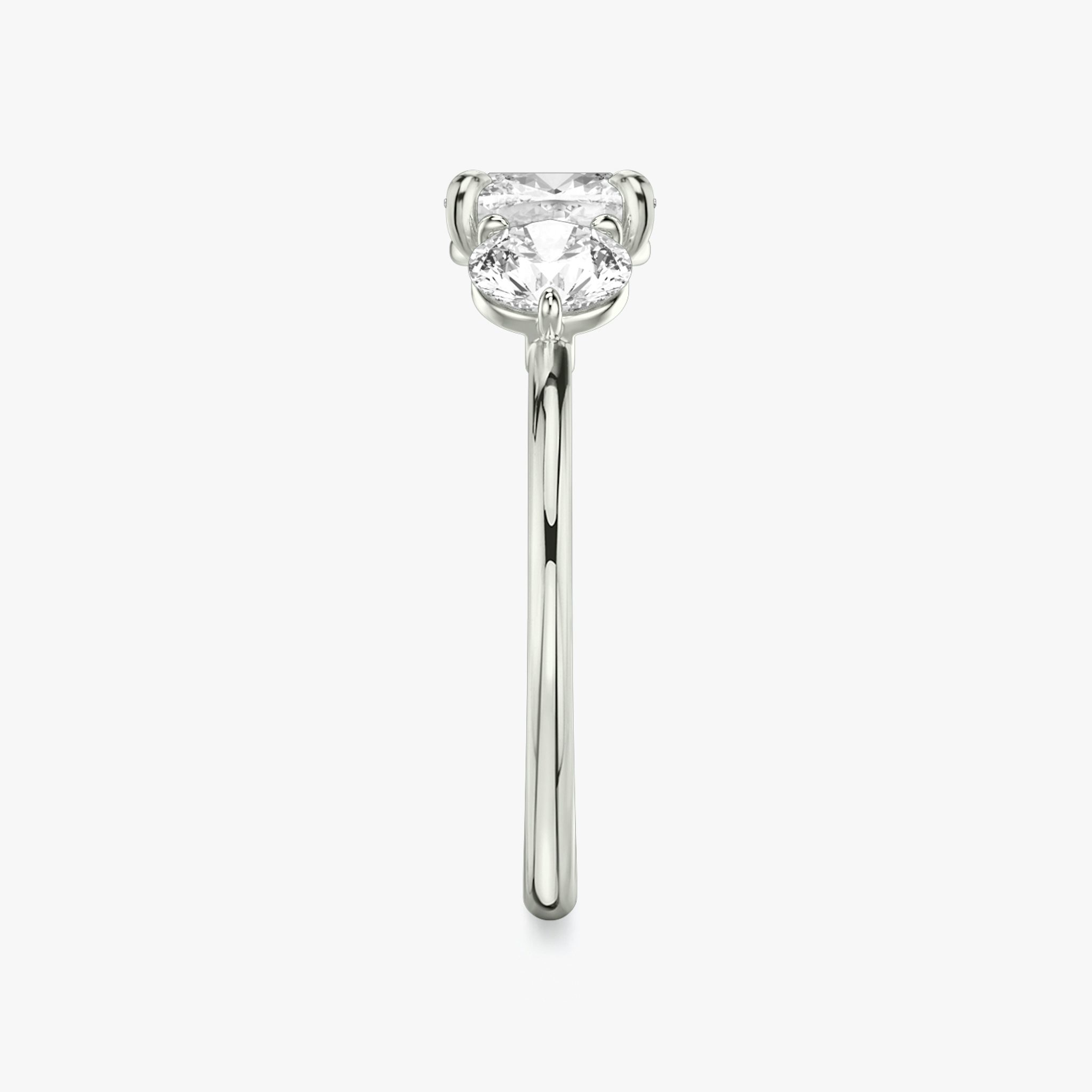 The Three Stone | Cushion | 18k | White Gold | bandAccent: Plain | sideStoneCarat: 0.50ct | sideStoneShape: Round Brilliant | diamondOrientation: vertical | caratWeight: other