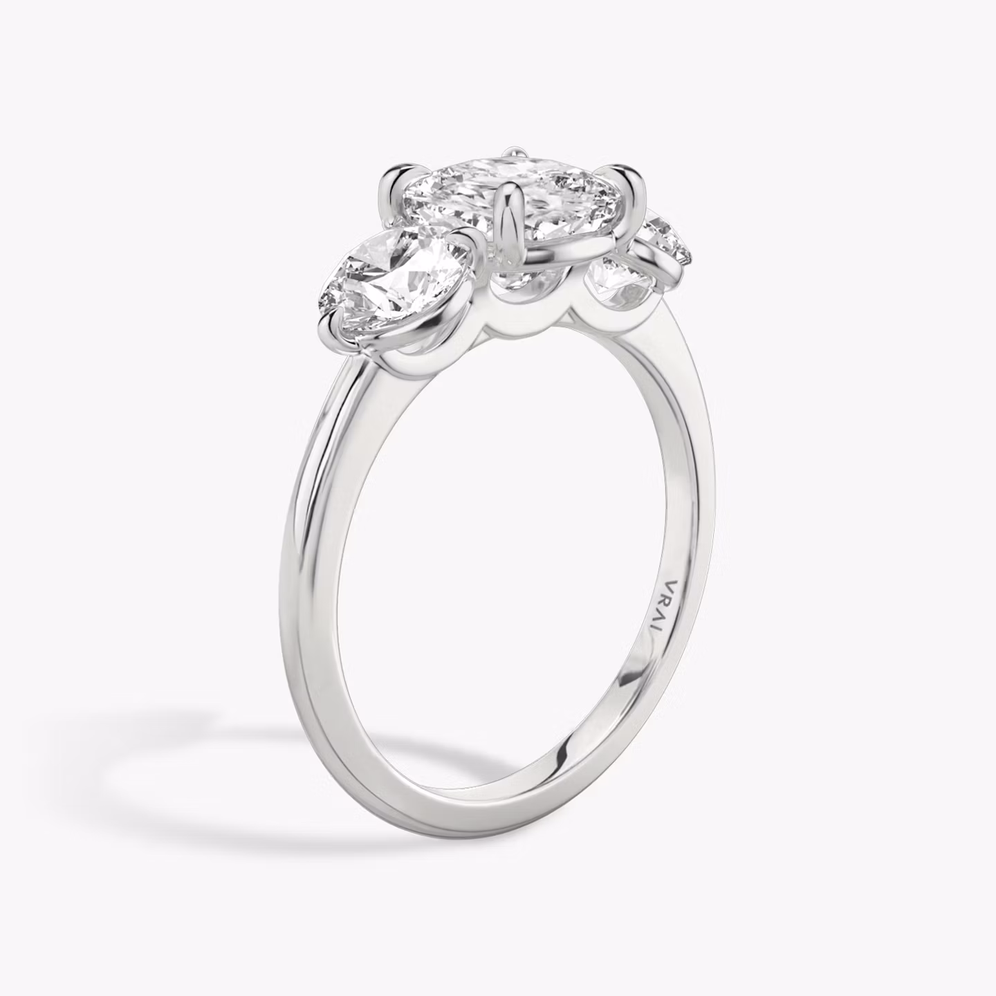 The Three Stone | Cushion | 18k | White Gold | bandAccent: Plain | sideStoneCarat: 0.50ct | sideStoneShape: Round Brilliant | diamondOrientation: vertical | caratWeight: other