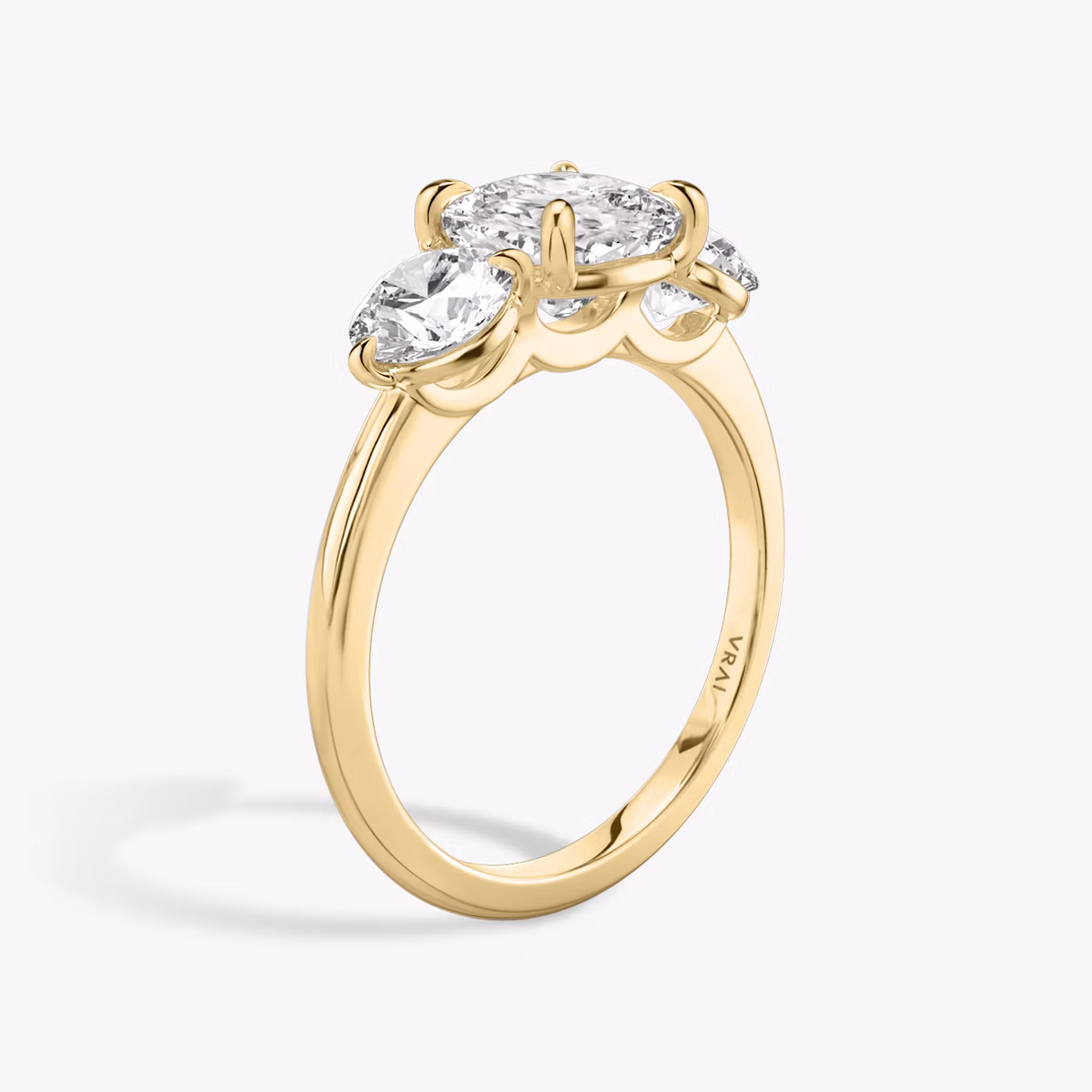 The Three Stone | Cushion | 18k | Yellow Gold | bandAccent: Plain | sideStoneCarat: 0.50ct | sideStoneShape: Round Brilliant | diamondOrientation: vertical | caratWeight: other