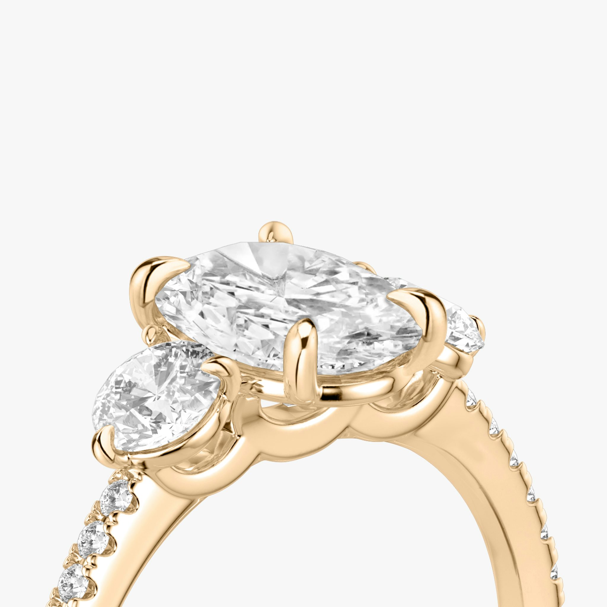 The Three Stone | Oval | 14k | Rose Gold | bandAccent: Pavé | sideStoneCarat: 0.25ct | sideStoneShape: Round Brilliant | diamondOrientation: vertical | caratWeight: other