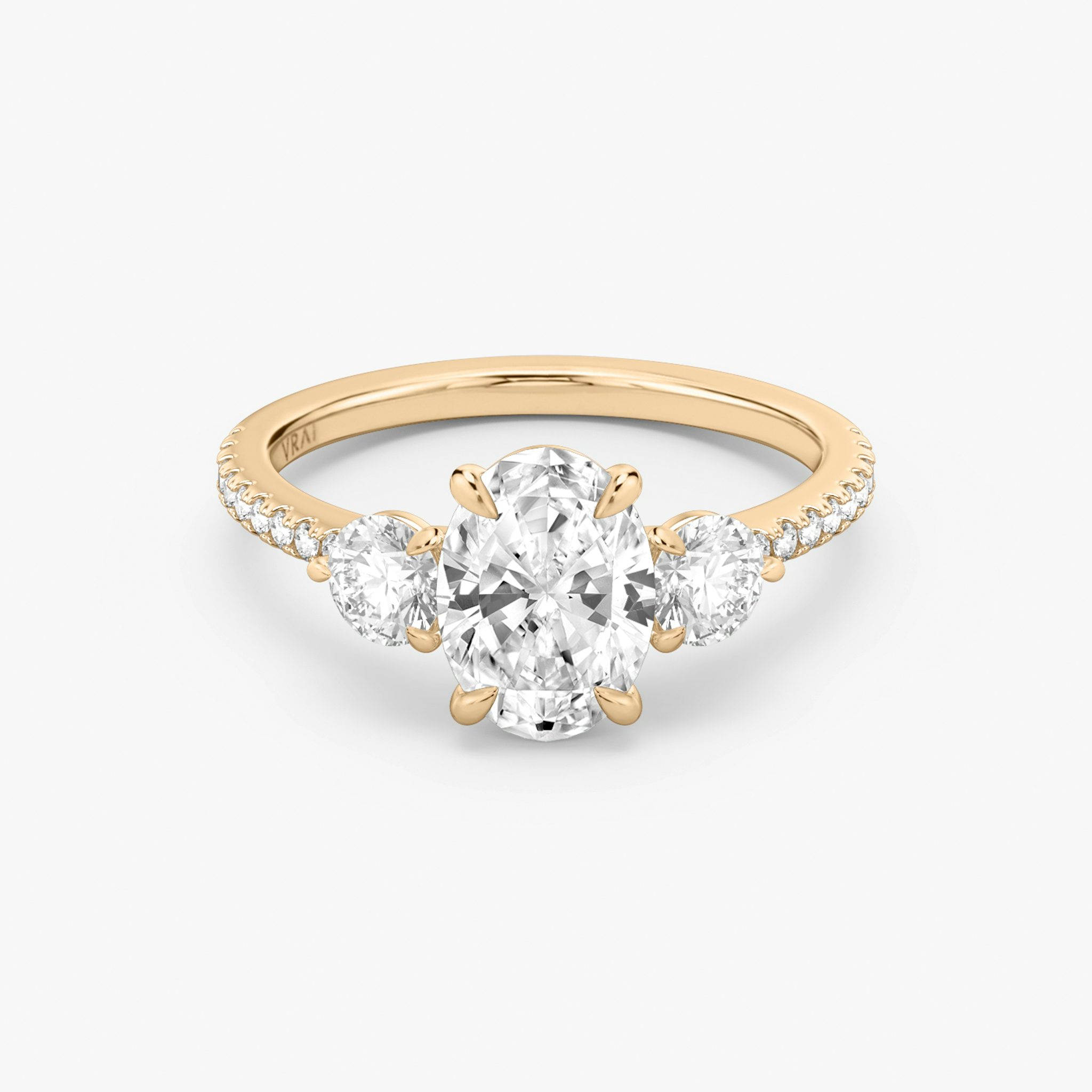 The Three Stone | Oval | 14k | Rose Gold | bandAccent: Pavé | sideStoneCarat: 0.25ct | sideStoneShape: Round Brilliant | diamondOrientation: vertical | caratWeight: other