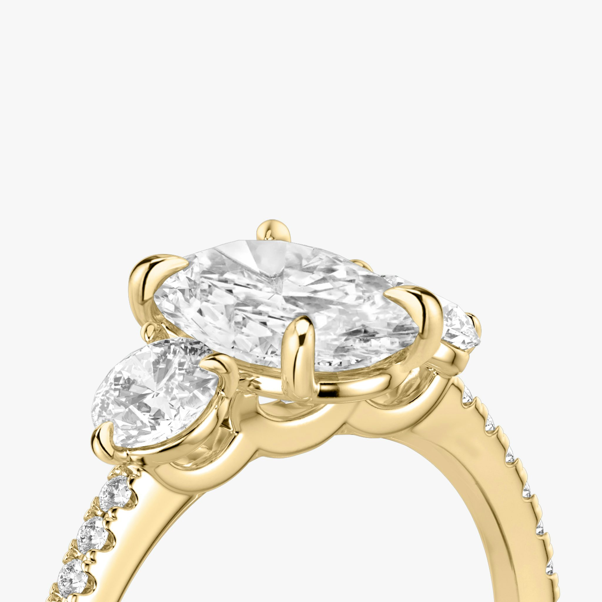 The Three Stone | Oval | 18k | Yellow Gold | bandAccent: Pavé | sideStoneCarat: 0.25ct | sideStoneShape: Round Brilliant | diamondOrientation: vertical | caratWeight: other