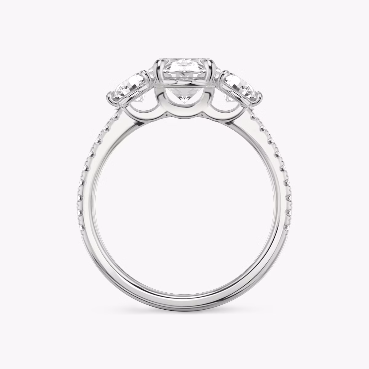The Three Stone | Oval | 18k | White Gold | bandAccent: Pavé | sideStoneCarat: 0.25ct | sideStoneShape: Round Brilliant | diamondOrientation: vertical | caratWeight: other