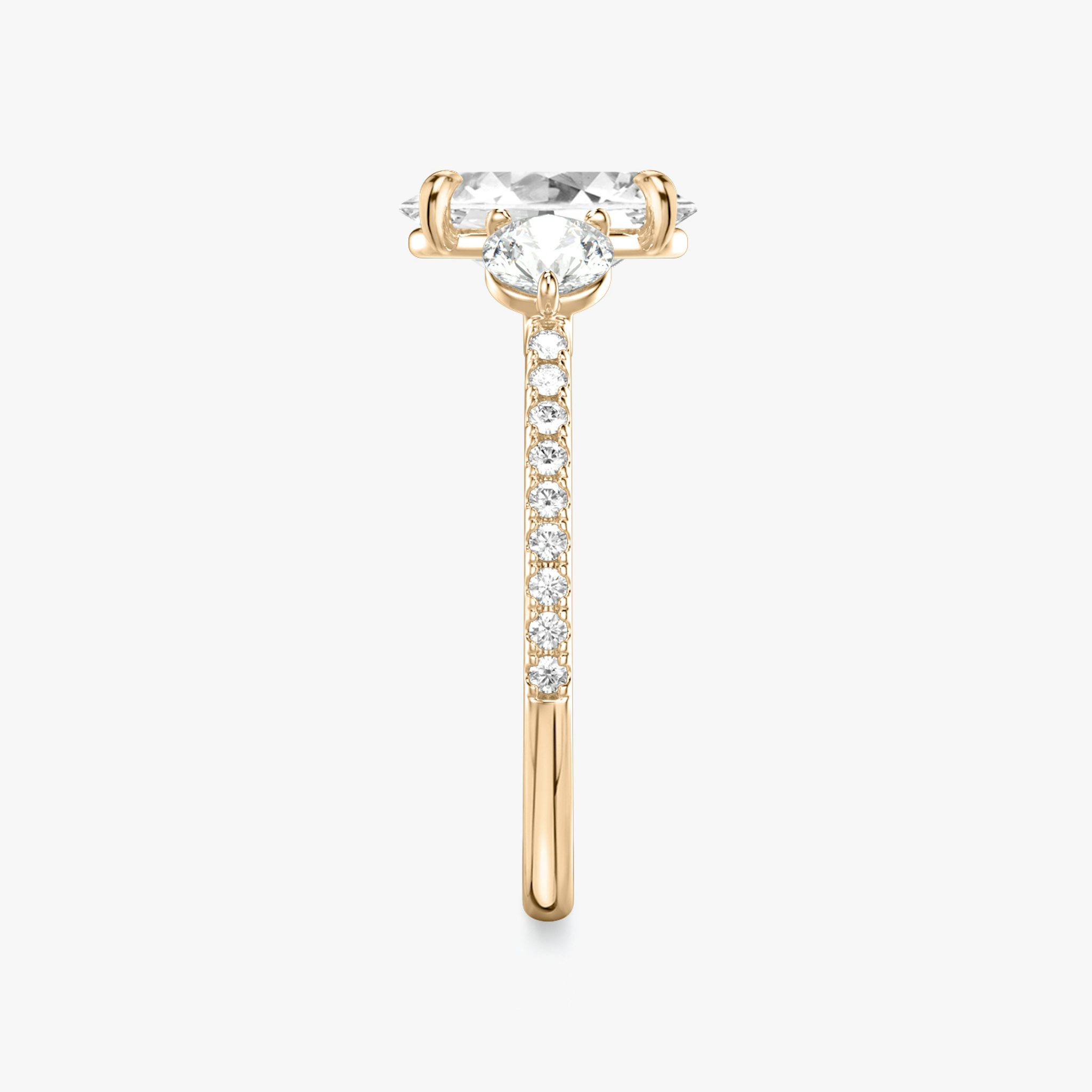 The Three Stone | Oval | 14k | Rose Gold | bandAccent: Pavé | sideStoneCarat: 0.25ct | sideStoneShape: Round Brilliant | diamondOrientation: vertical | caratWeight: other