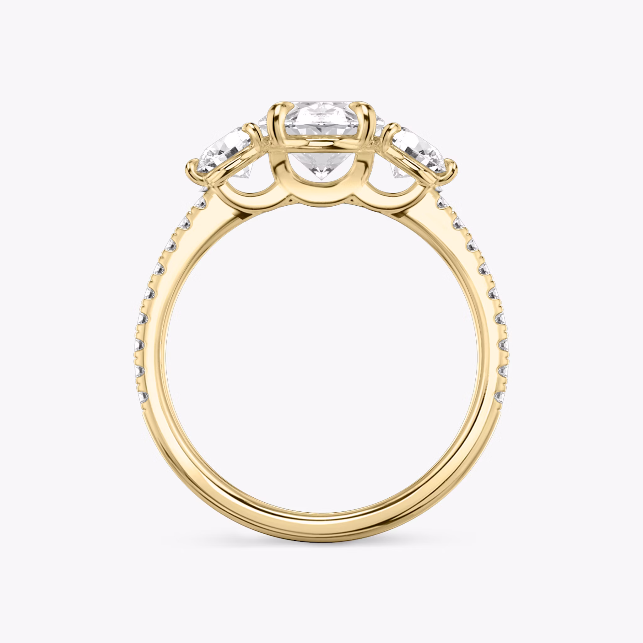 The Three Stone | Oval | 18k | Yellow Gold | bandAccent: Pavé | sideStoneCarat: 0.25ct | sideStoneShape: Round Brilliant | diamondOrientation: vertical | caratWeight: other