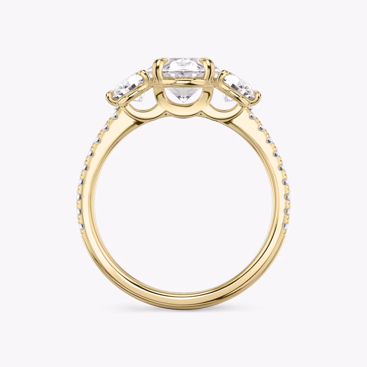 The Three Stone | Oval | 18k | Yellow Gold | bandAccent: Pavé | sideStoneCarat: 0.25ct | sideStoneShape: Round Brilliant | diamondOrientation: vertical | caratWeight: other