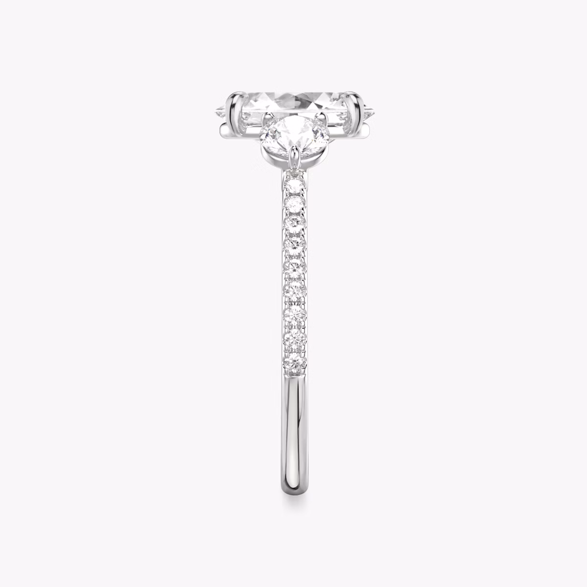 The Three Stone | Oval | 18k | White Gold | bandAccent: Pavé | sideStoneCarat: 0.25ct | sideStoneShape: Round Brilliant | diamondOrientation: vertical | caratWeight: other