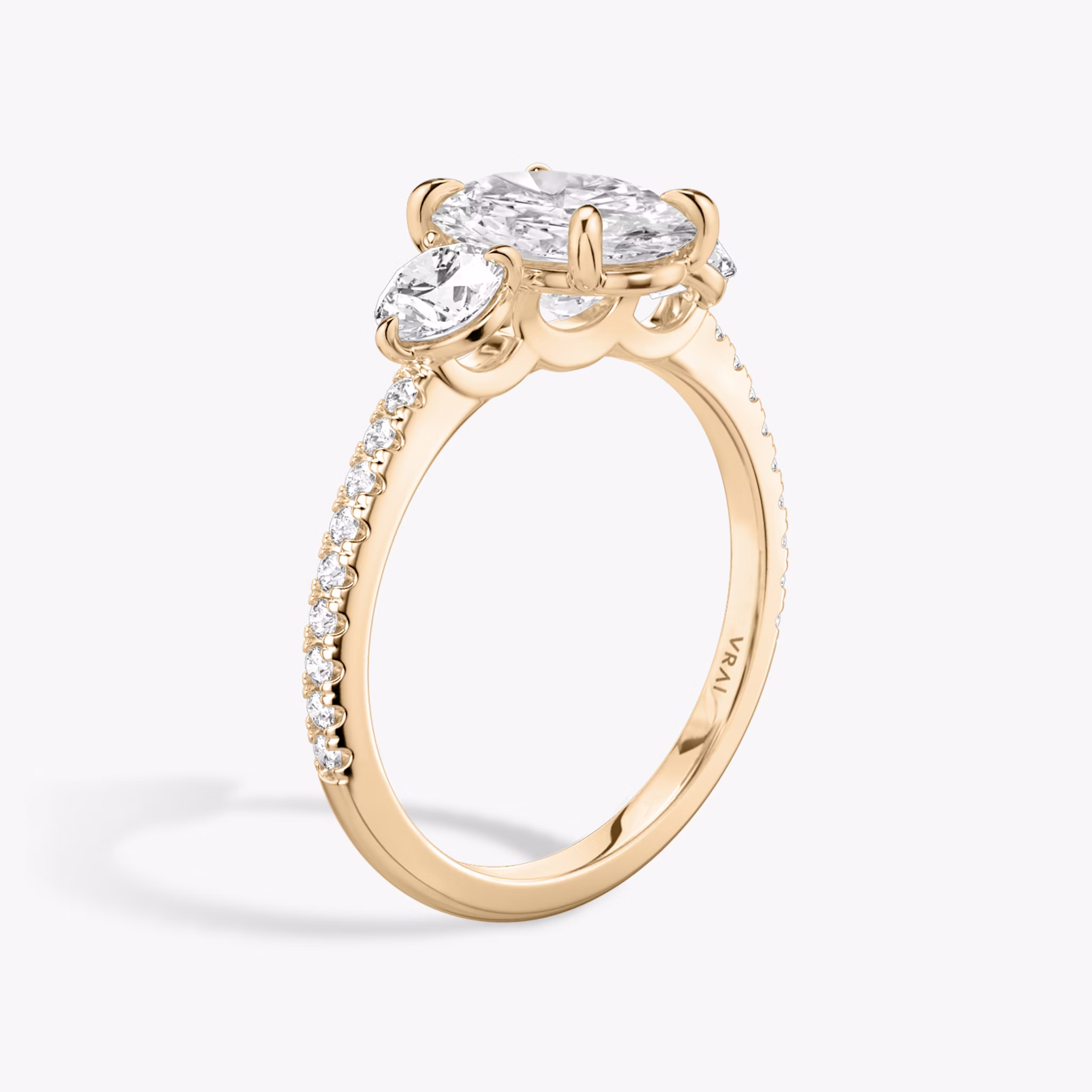 The Three Stone | Oval | 14k | Rose Gold | bandAccent: Pavé | sideStoneCarat: 0.25ct | sideStoneShape: Round Brilliant | diamondOrientation: vertical | caratWeight: other