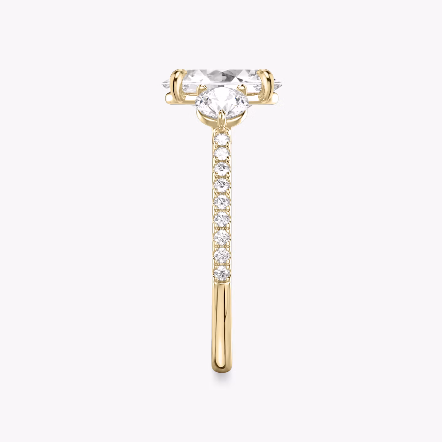 The Three Stone | Oval | 18k | Yellow Gold | bandAccent: Pavé | sideStoneCarat: 0.25ct | sideStoneShape: Round Brilliant | diamondOrientation: vertical | caratWeight: other