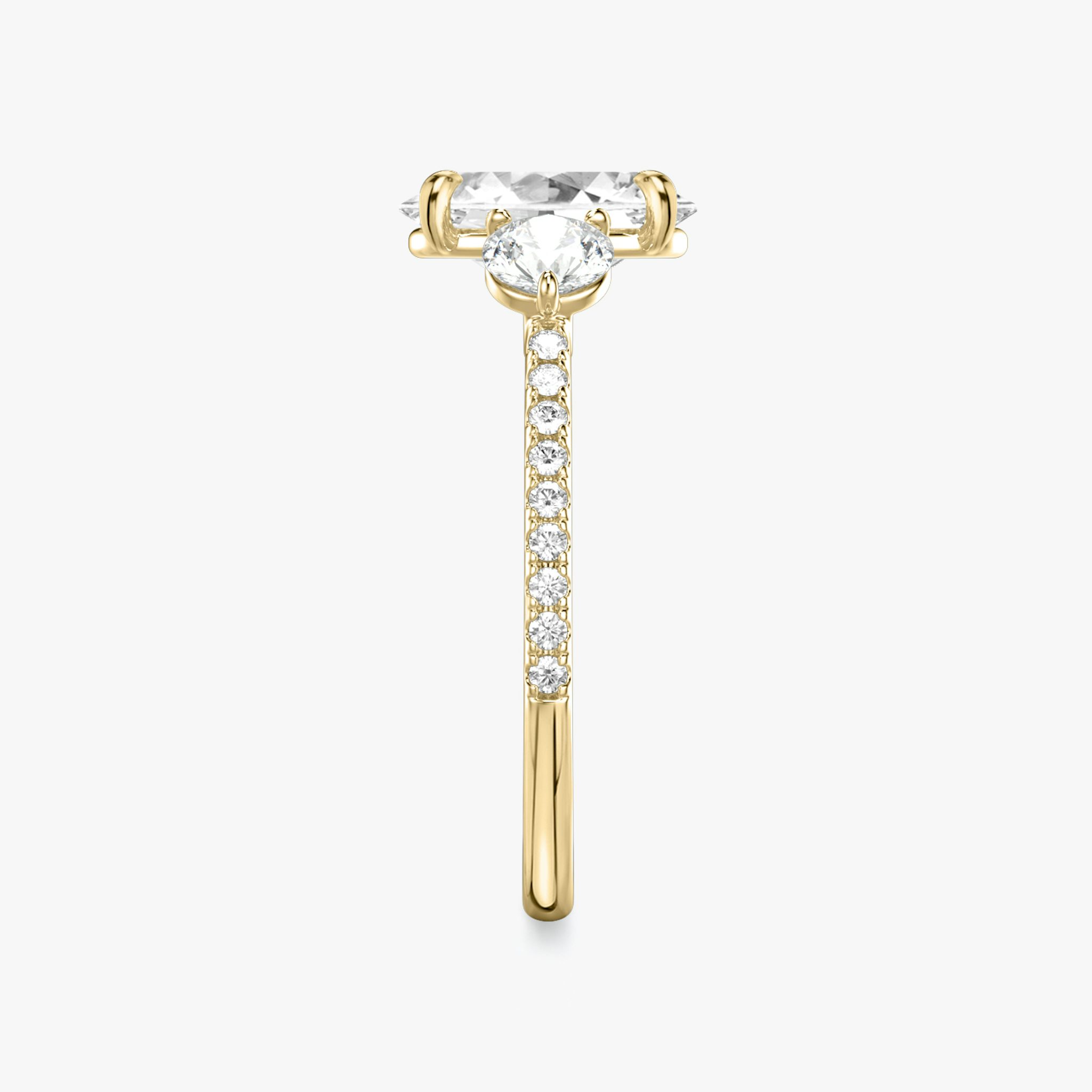 The Three Stone | Oval | 18k | Yellow Gold | bandAccent: Pavé | sideStoneCarat: 0.25ct | sideStoneShape: Round Brilliant | diamondOrientation: vertical | caratWeight: other