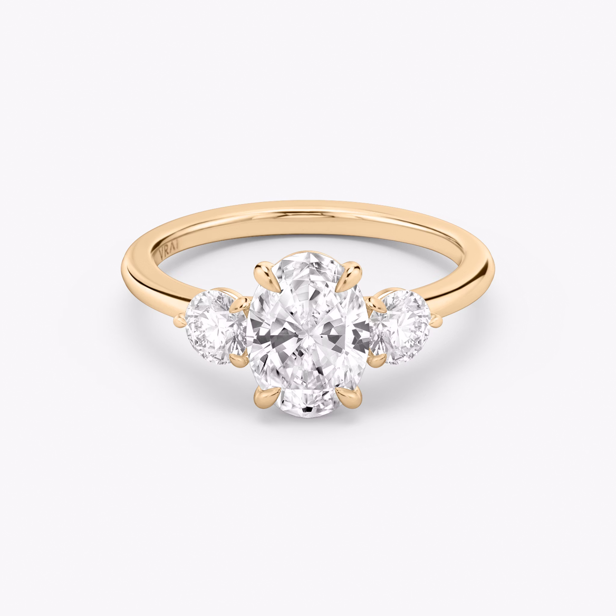 The Three Stone | Oval | 14k | Rose Gold | bandAccent: Plain | sideStoneCarat: 0.25ct | sideStoneShape: Round Brilliant | diamondOrientation: vertical | caratWeight: other
