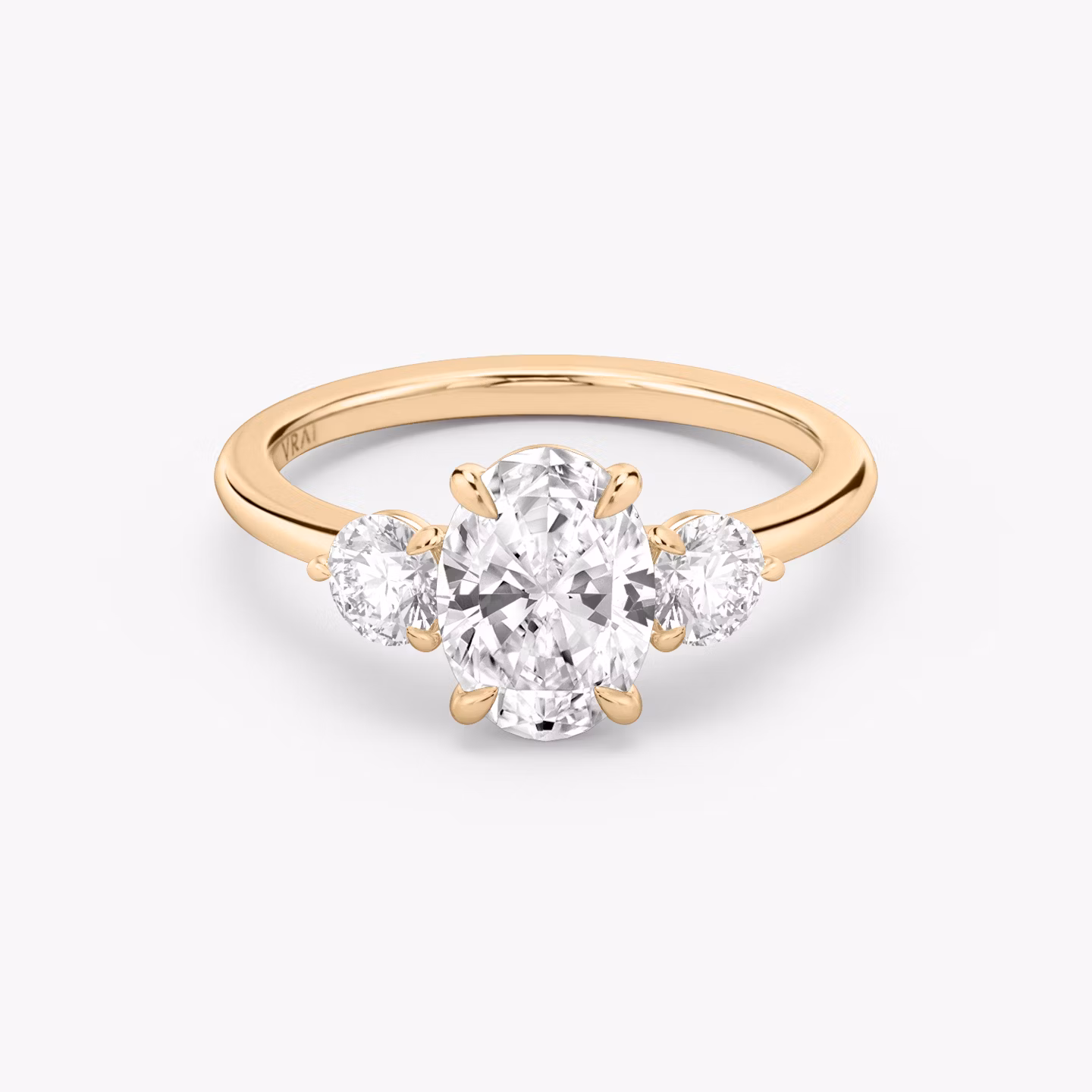 The Three Stone | Oval | 14k | Rose Gold | bandAccent: Plain | sideStoneCarat: 0.25ct | sideStoneShape: Round Brilliant | diamondOrientation: vertical | caratWeight: other
