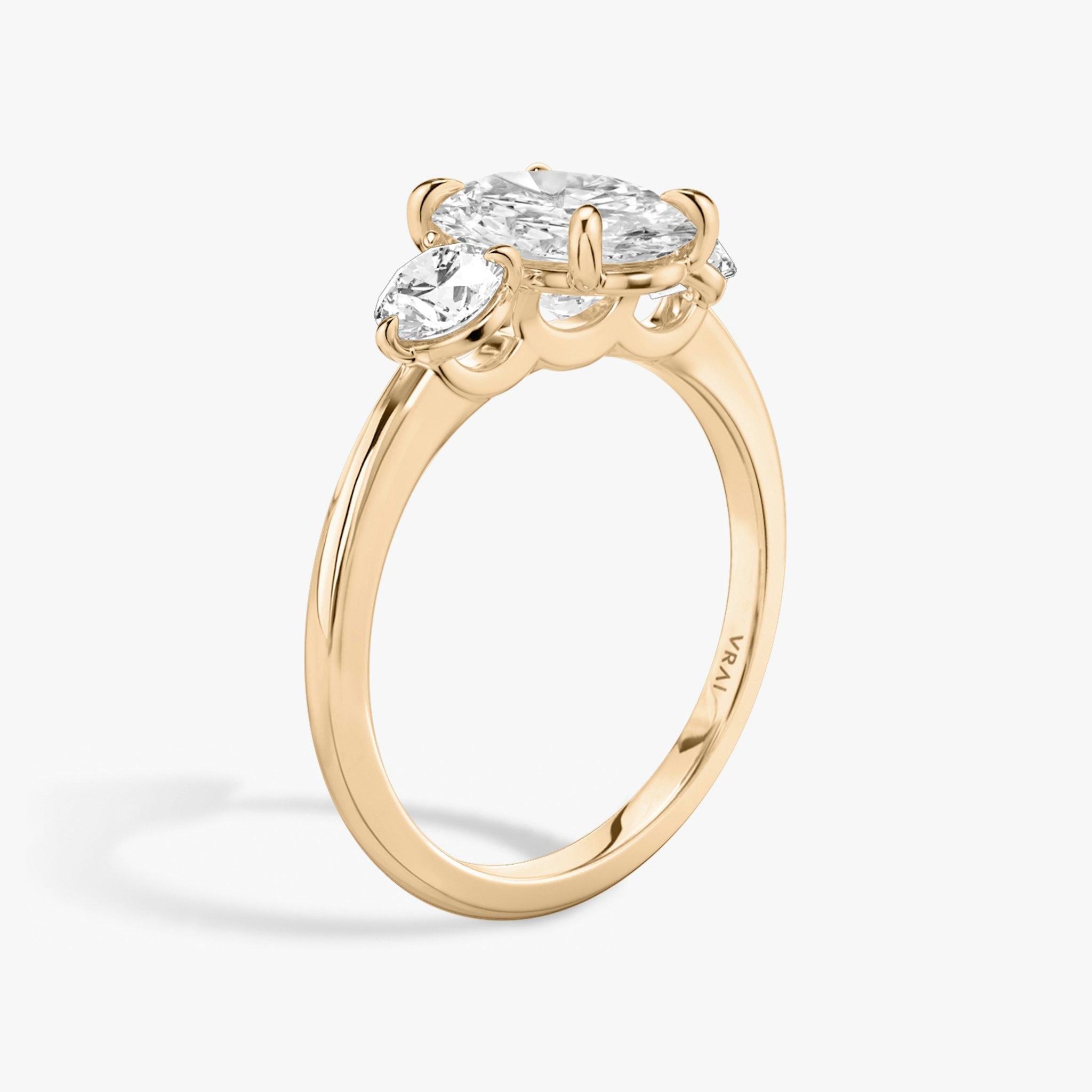 The Three Stone | Oval | 14k | Rose Gold | bandAccent: Plain | sideStoneCarat: 0.25ct | sideStoneShape: Round Brilliant | diamondOrientation: vertical | caratWeight: other