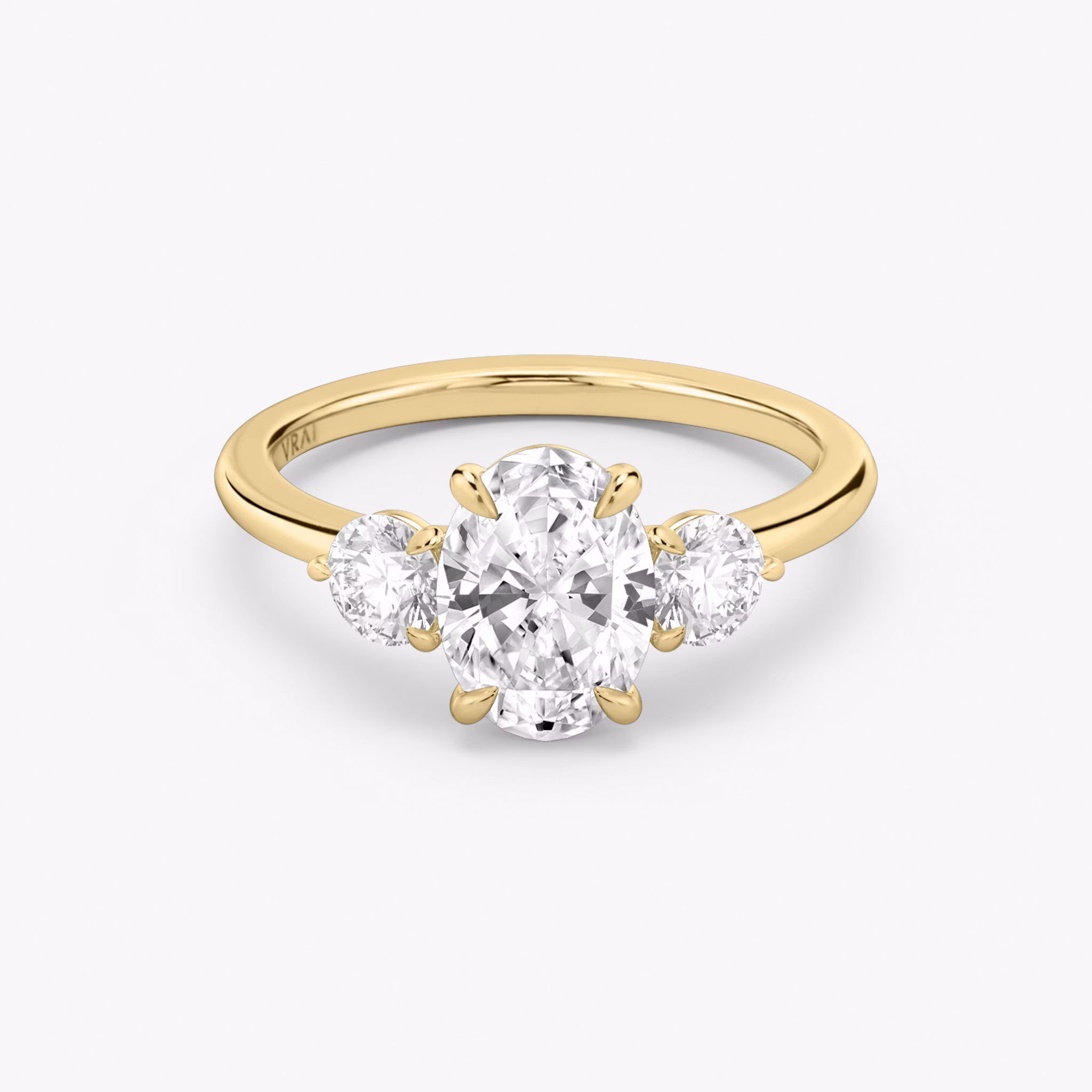 The Three Stone | Oval | 18k | Yellow Gold | bandAccent: Plain | sideStoneCarat: 0.25ct | sideStoneShape: Round Brilliant | diamondOrientation: vertical | caratWeight: other