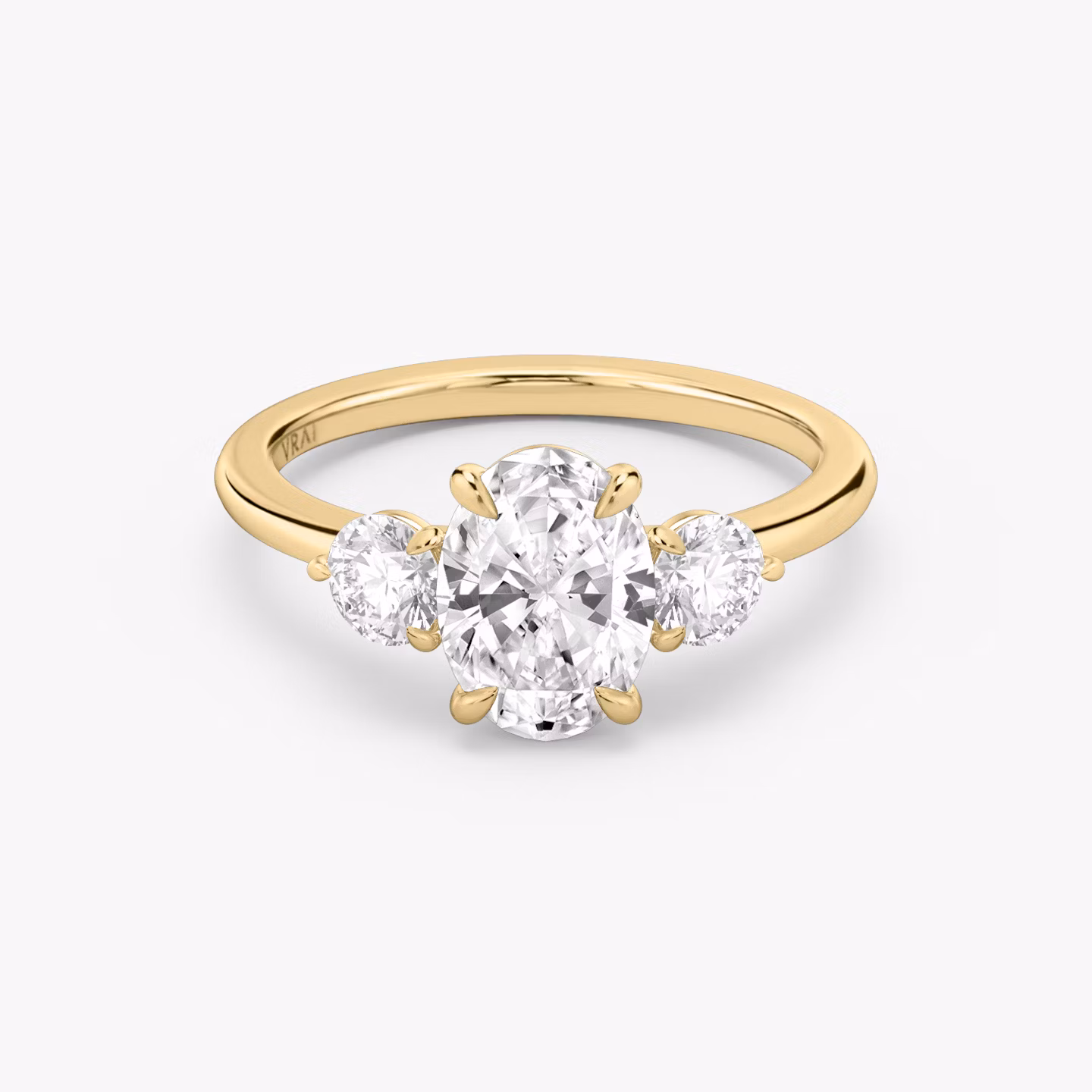 The Three Stone | Oval | 18k | Yellow Gold | bandAccent: Plain | sideStoneCarat: 0.25ct | sideStoneShape: Round Brilliant | diamondOrientation: vertical | caratWeight: other