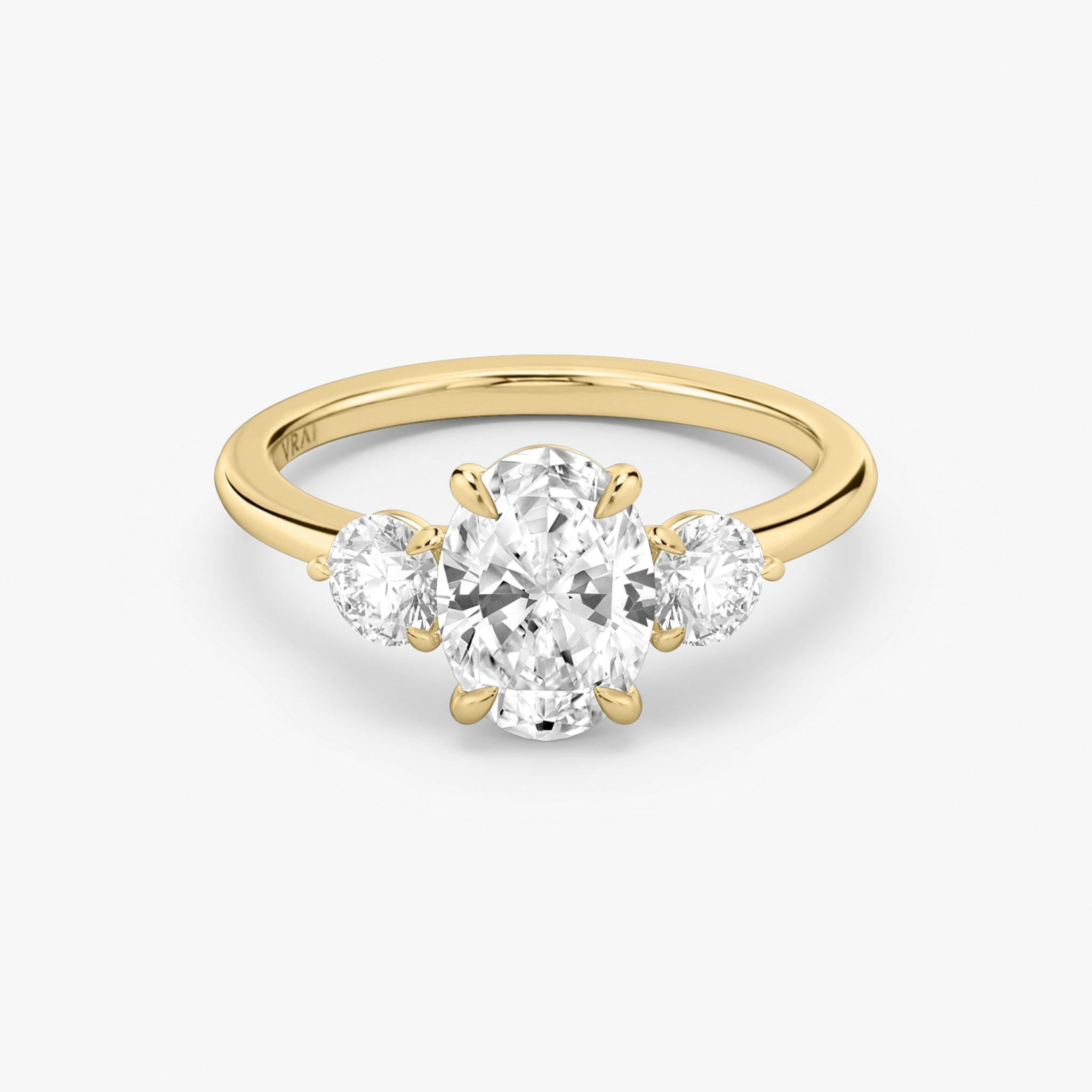 The Three Stone | Oval | 18k | Yellow Gold | bandAccent: Plain | sideStoneCarat: 0.25ct | sideStoneShape: Round Brilliant | diamondOrientation: vertical | caratWeight: other