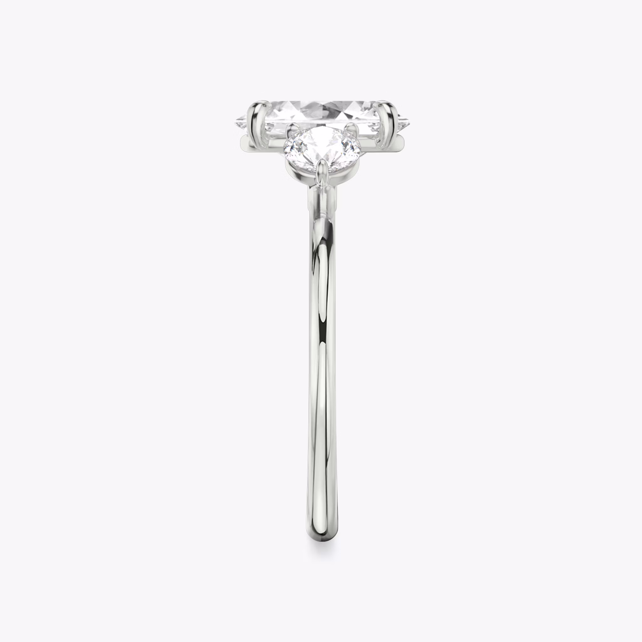 The Three Stone | Oval | 18k | White Gold | bandAccent: Plain | sideStoneCarat: 0.25ct | sideStoneShape: Round Brilliant | diamondOrientation: vertical | caratWeight: other