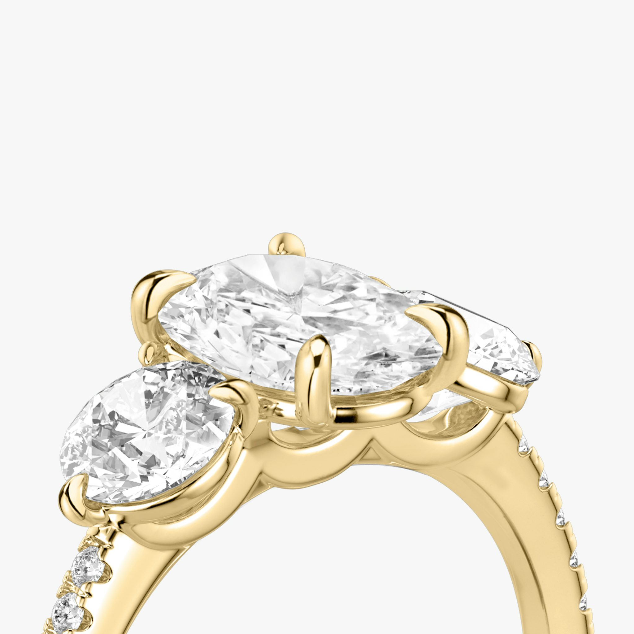 The Three Stone | Oval | 18k | Yellow Gold | bandAccent: Pavé | sideStoneCarat: 0.50ct | sideStoneShape: Round Brilliant | diamondOrientation: vertical | caratWeight: other