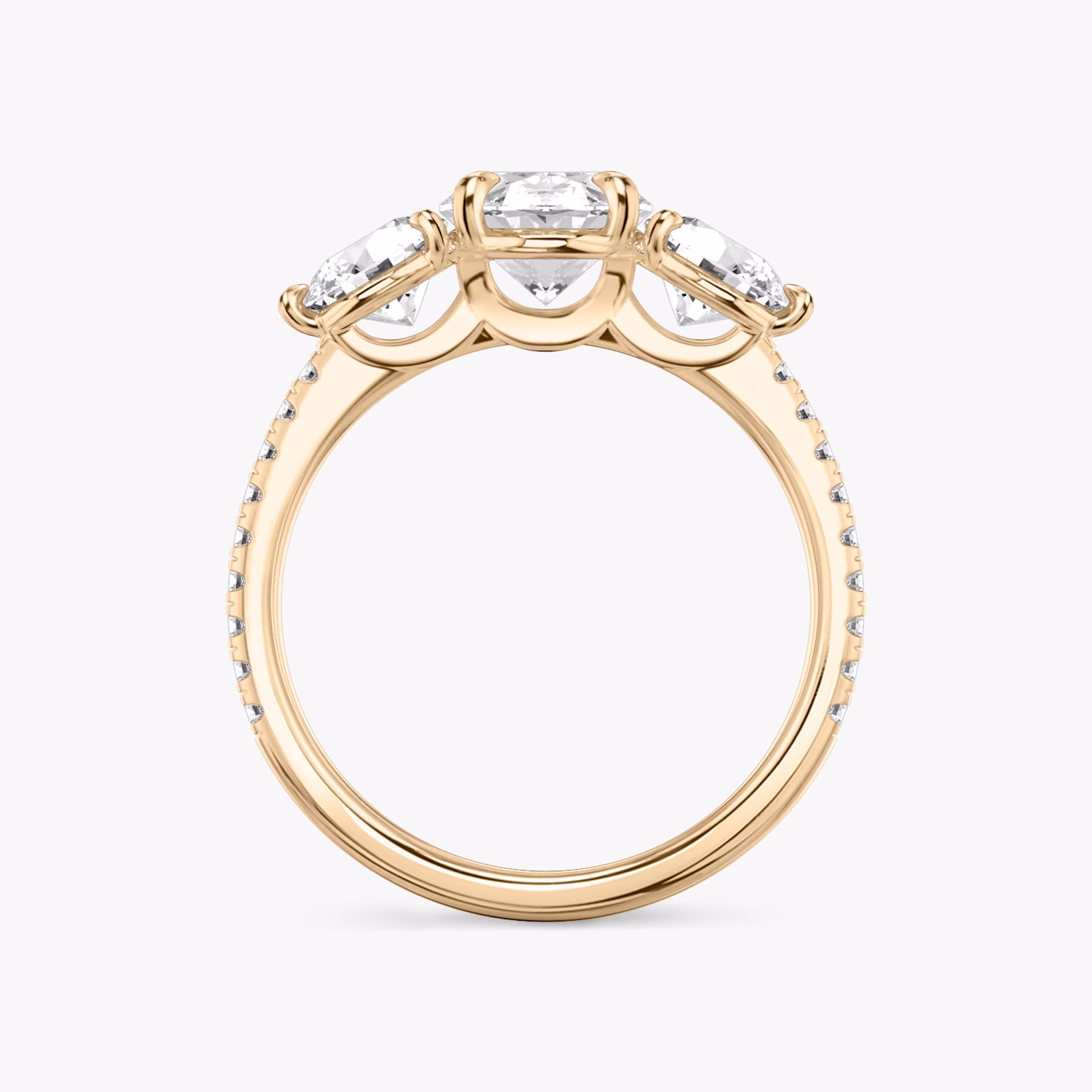 The Three Stone | Oval | 14k | Rose Gold | bandAccent: Pavé | sideStoneCarat: 0.50ct | sideStoneShape: Round Brilliant | diamondOrientation: vertical | caratWeight: other