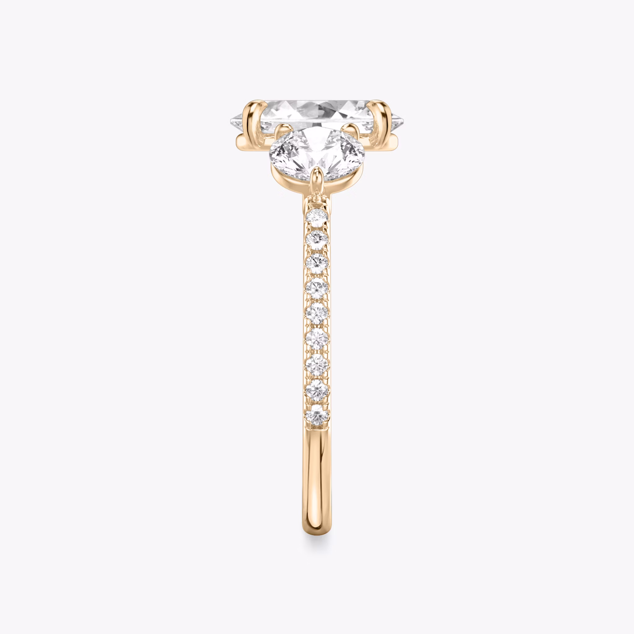 The Three Stone | Oval | 14k | Rose Gold | bandAccent: Pavé | sideStoneCarat: 0.50ct | sideStoneShape: Round Brilliant | diamondOrientation: vertical | caratWeight: other