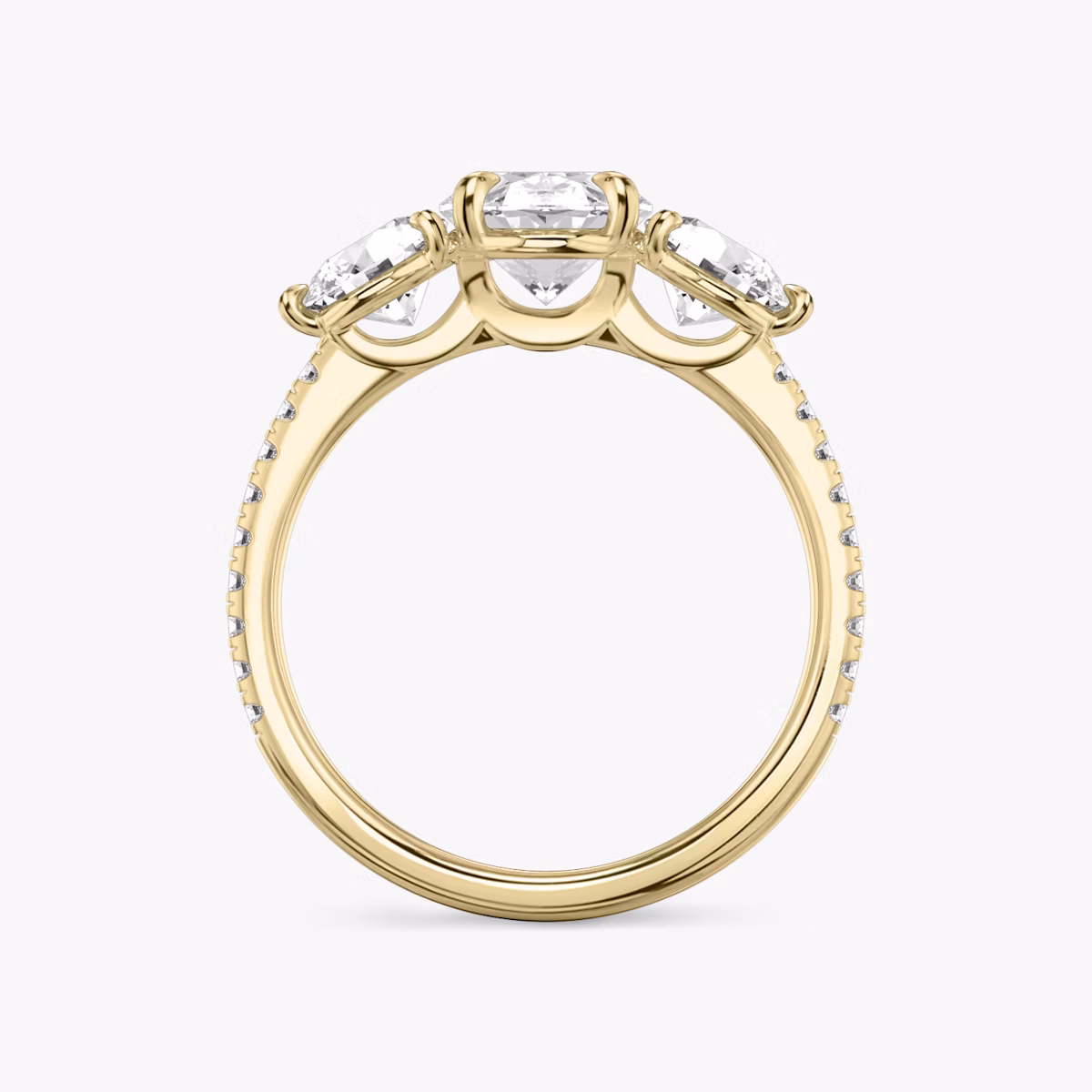 The Three Stone | Oval | 18k | Yellow Gold | bandAccent: Pavé | sideStoneCarat: 0.50ct | sideStoneShape: Round Brilliant | diamondOrientation: vertical | caratWeight: other