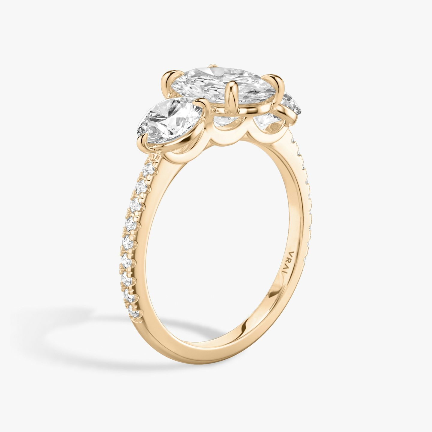 The Three Stone | Oval | 14k | Rose Gold | bandAccent: Pavé | sideStoneCarat: 0.50ct | sideStoneShape: Round Brilliant | diamondOrientation: vertical | caratWeight: other