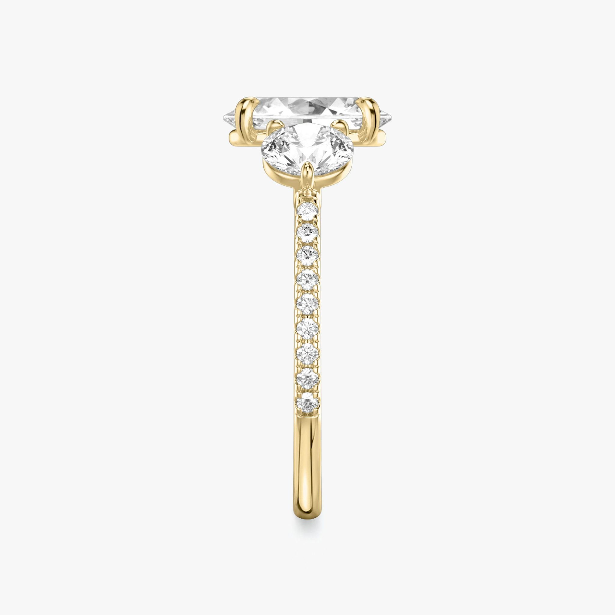 The Three Stone | Oval | 18k | Yellow Gold | bandAccent: Pavé | sideStoneCarat: 0.50ct | sideStoneShape: Round Brilliant | diamondOrientation: vertical | caratWeight: other