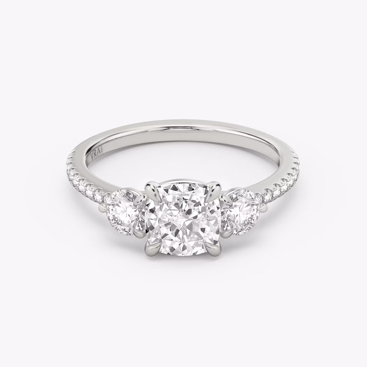 Three Stone Cushion and Round Brilliant RIng