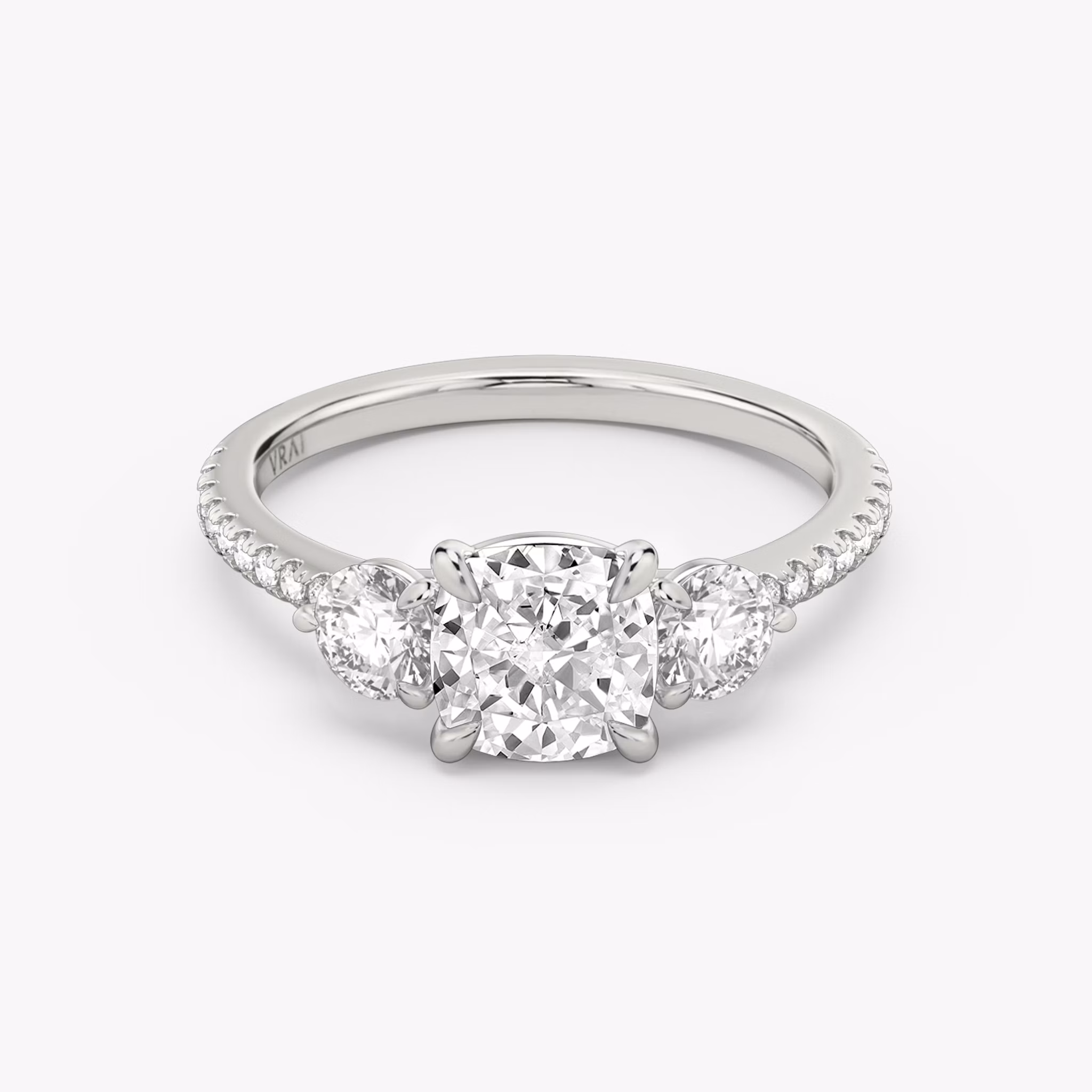 Three Stone Cushion and Round Brilliant RIng