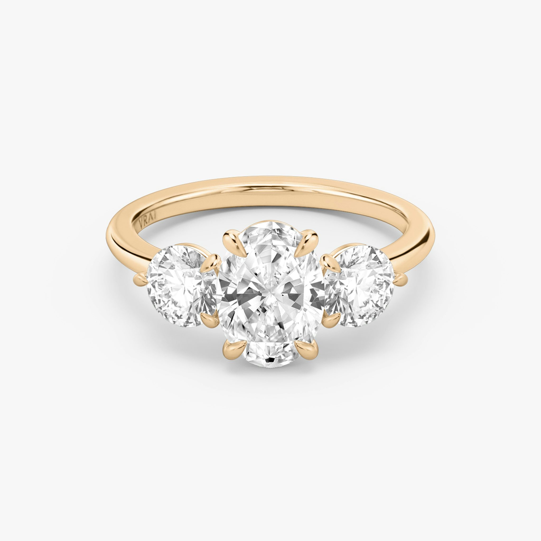 The Three Stone | Oval | 14k | Rose Gold | bandAccent: Plain | sideStoneCarat: 0.50ct | sideStoneShape: Round Brilliant | diamondOrientation: vertical | caratWeight: other