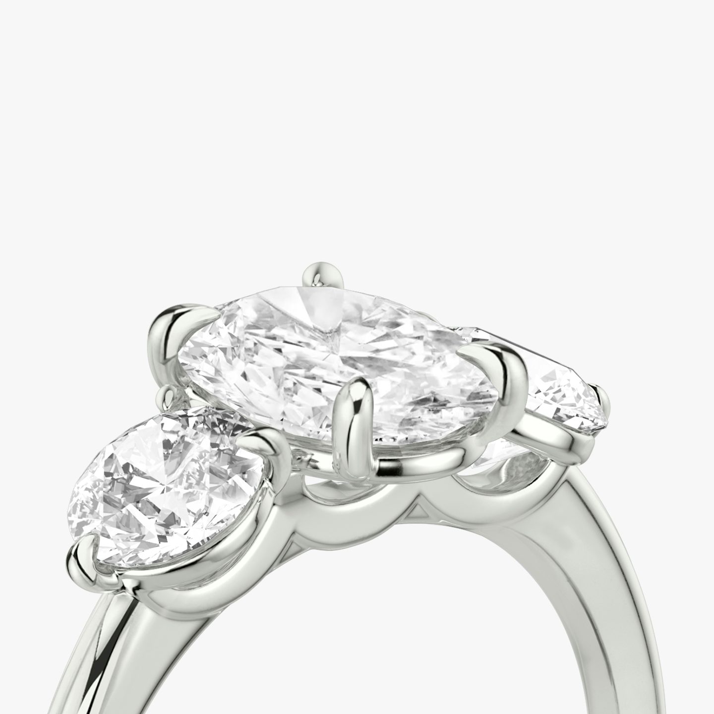 The Three Stone | Oval | Platinum | bandAccent: Plain | sideStoneCarat: 0.50ct | sideStoneShape: Round Brilliant | diamondOrientation: vertical | caratWeight: other